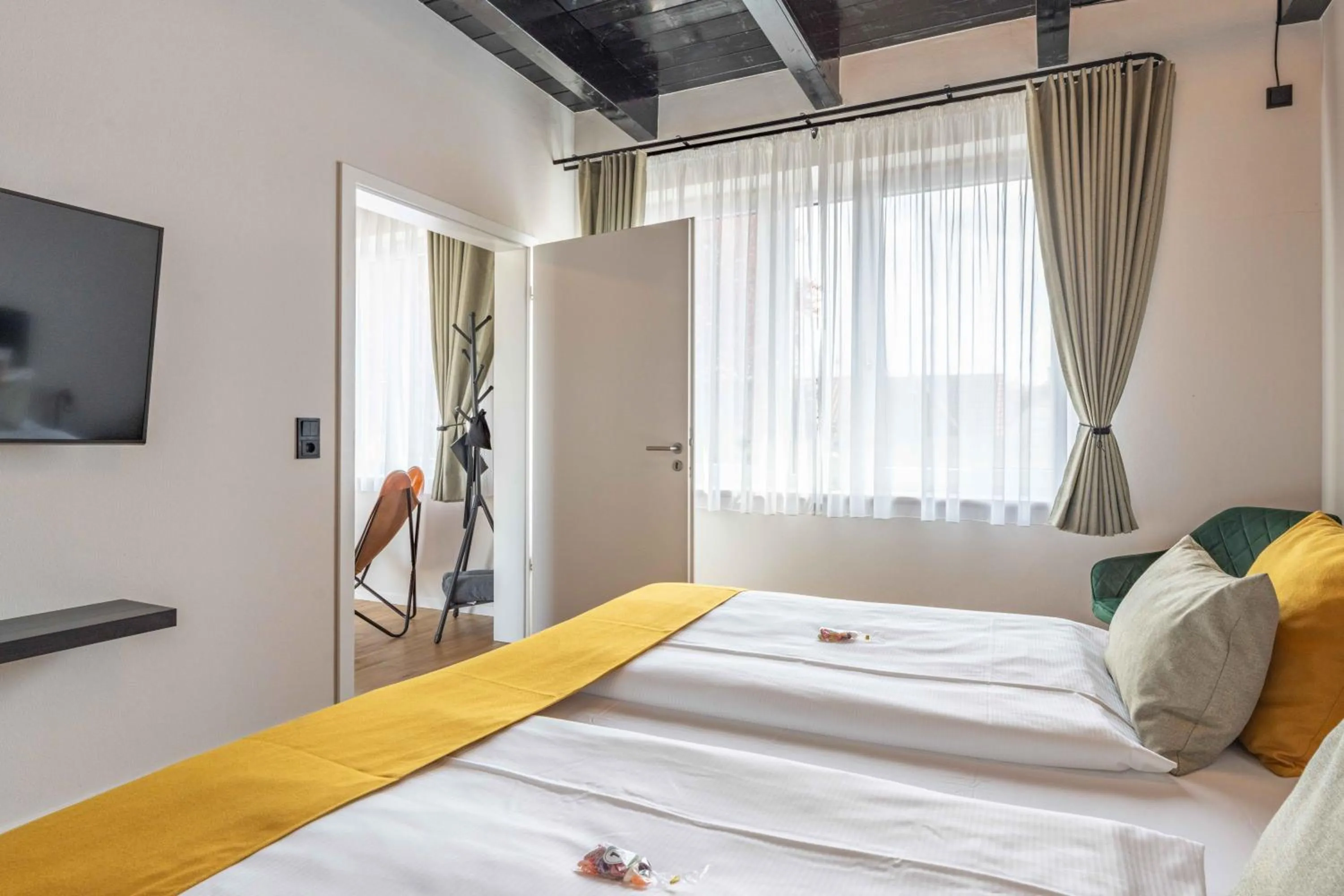 Bed in LÜTTES LOFT Boutique Hotel