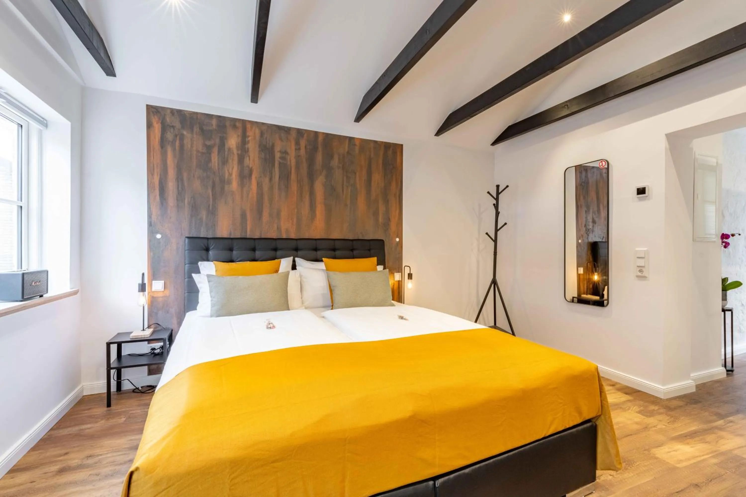 Bed in LÜTTES LOFT Boutique Hotel