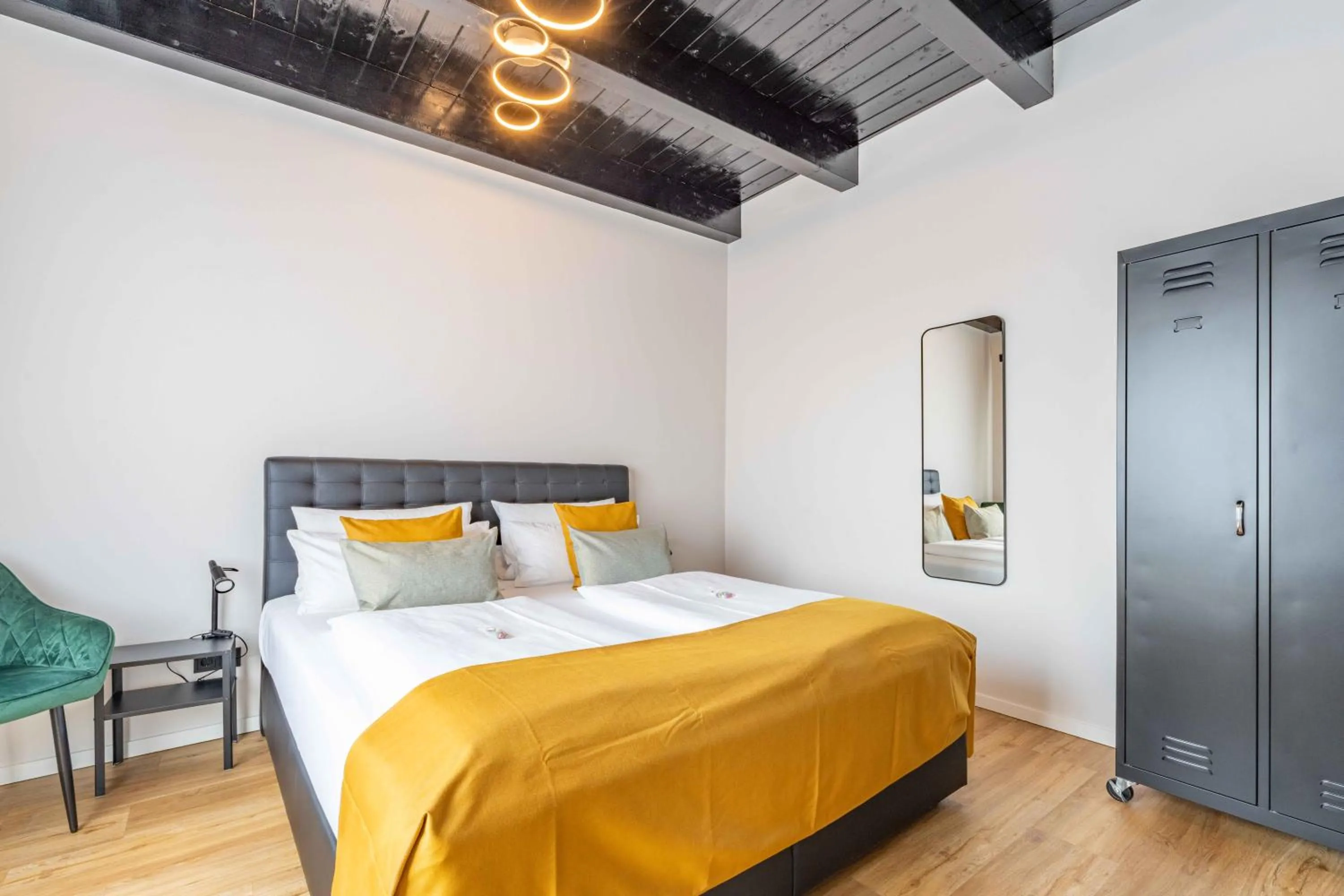 Bed in LÜTTES LOFT Boutique Hotel