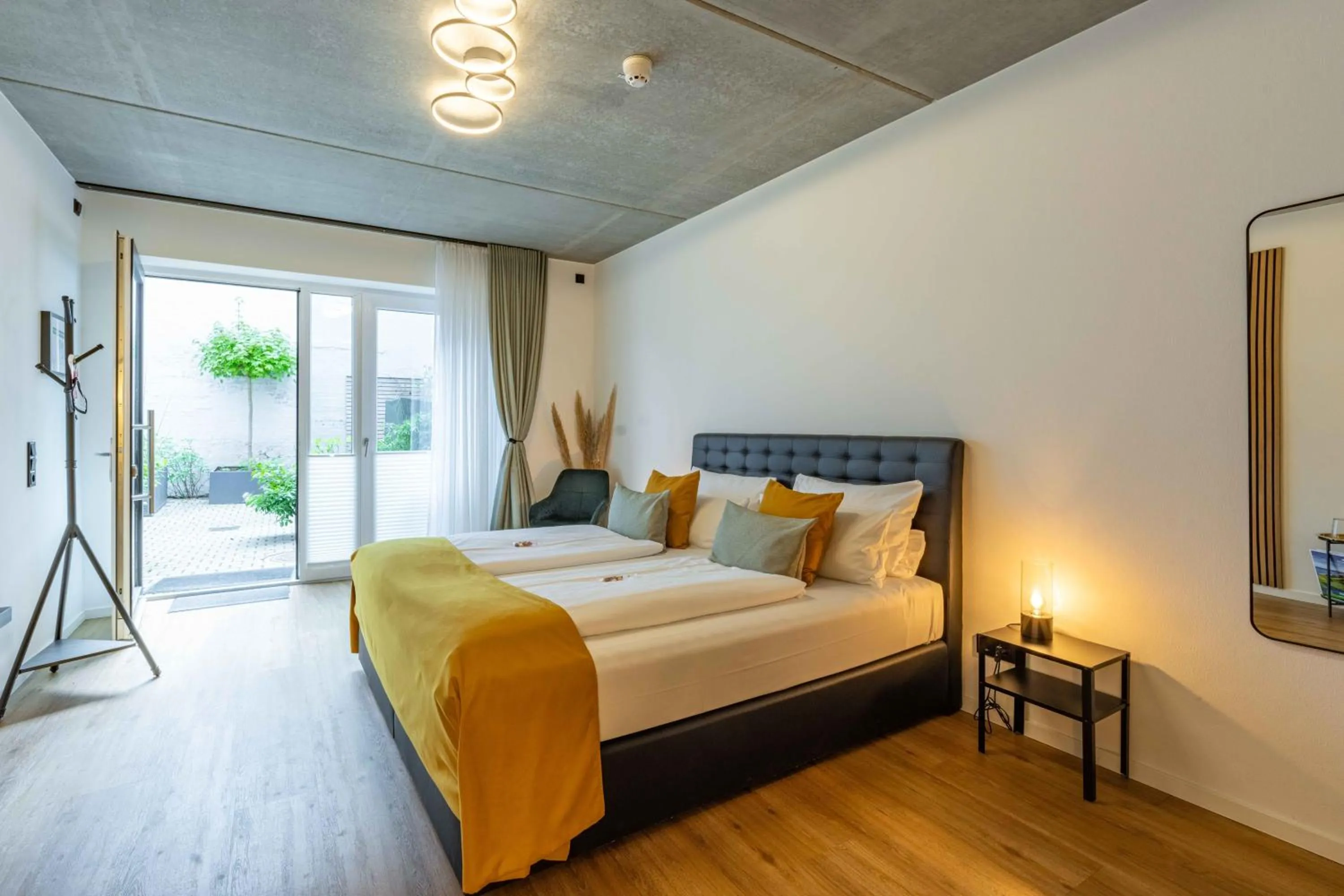 Bed in LÜTTES LOFT Boutique Hotel