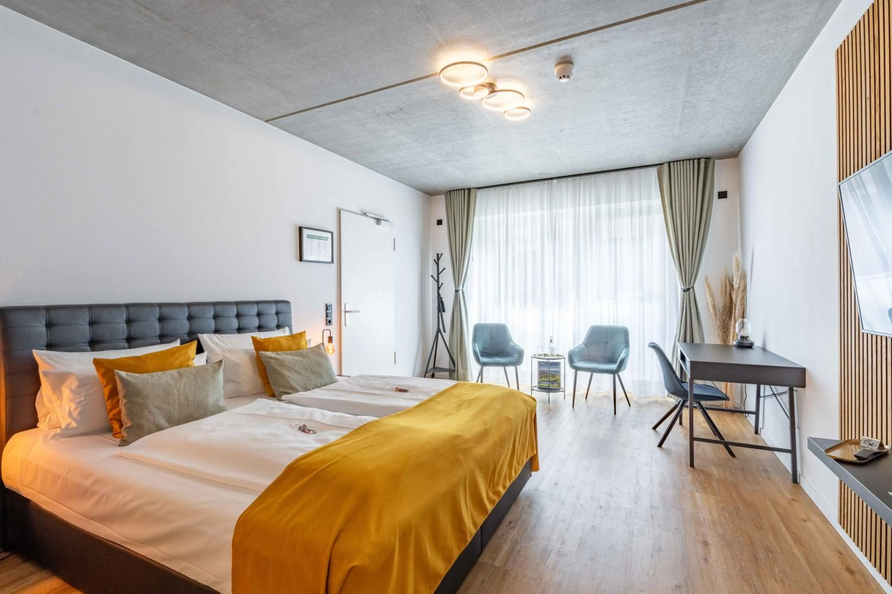 Bed in LÜTTES LOFT Boutique Hotel