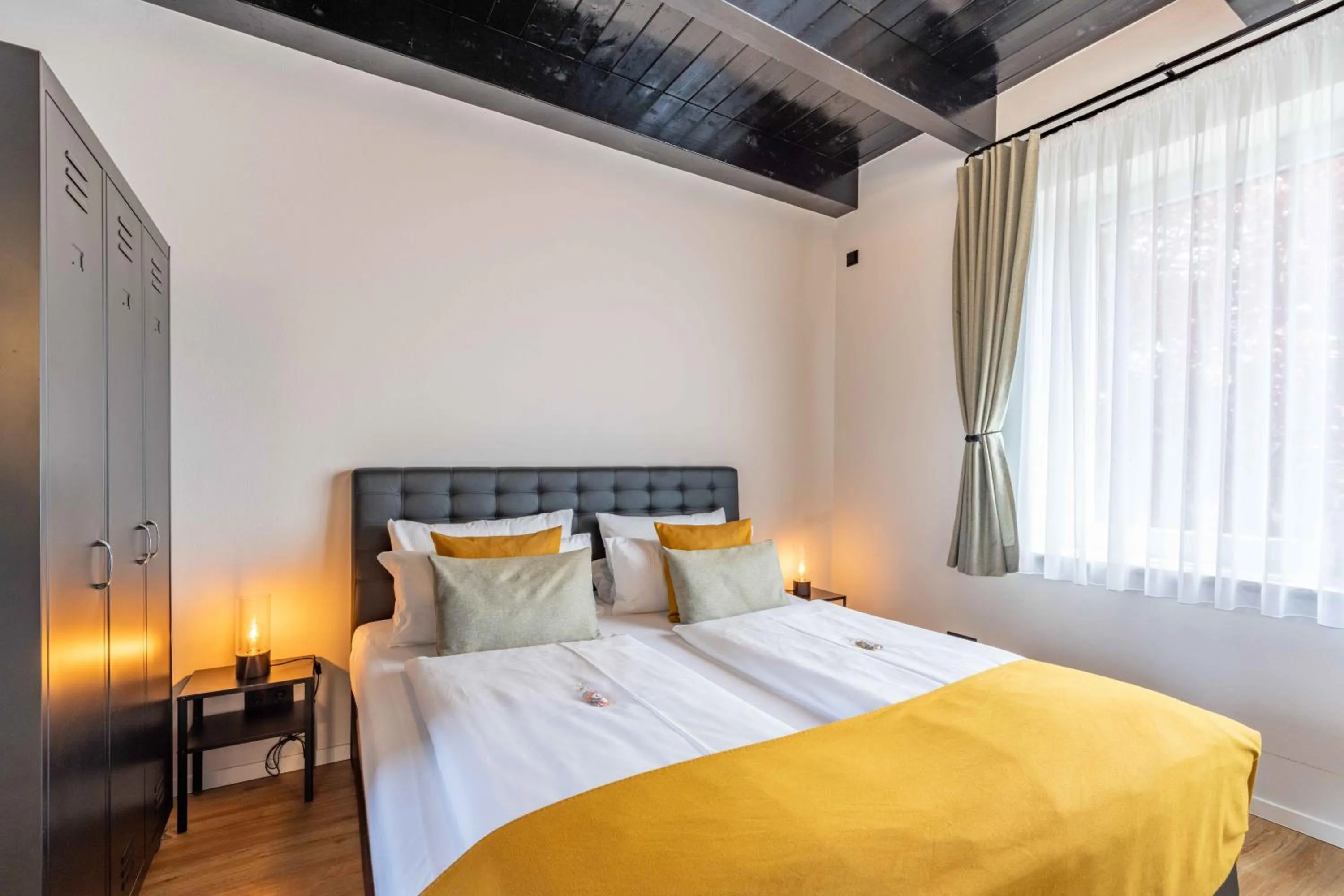 Bed in LÜTTES LOFT Boutique Hotel