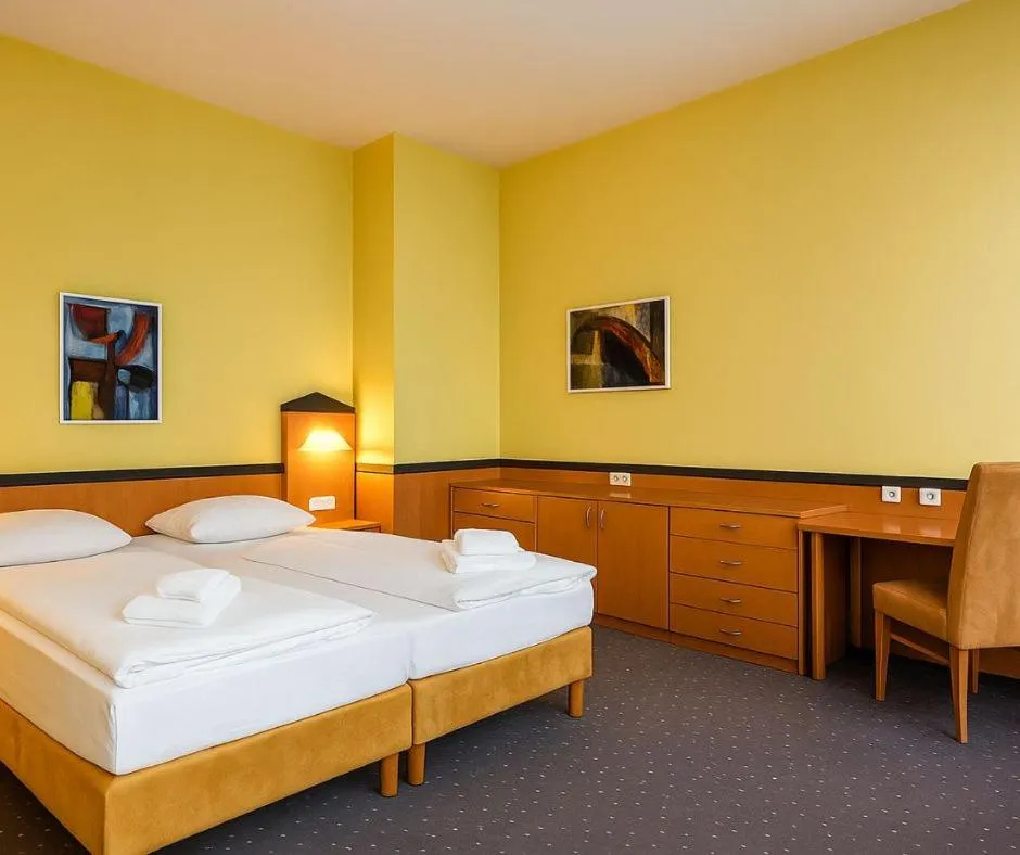 Bed in Plaza Hotel & Living Frankfurt