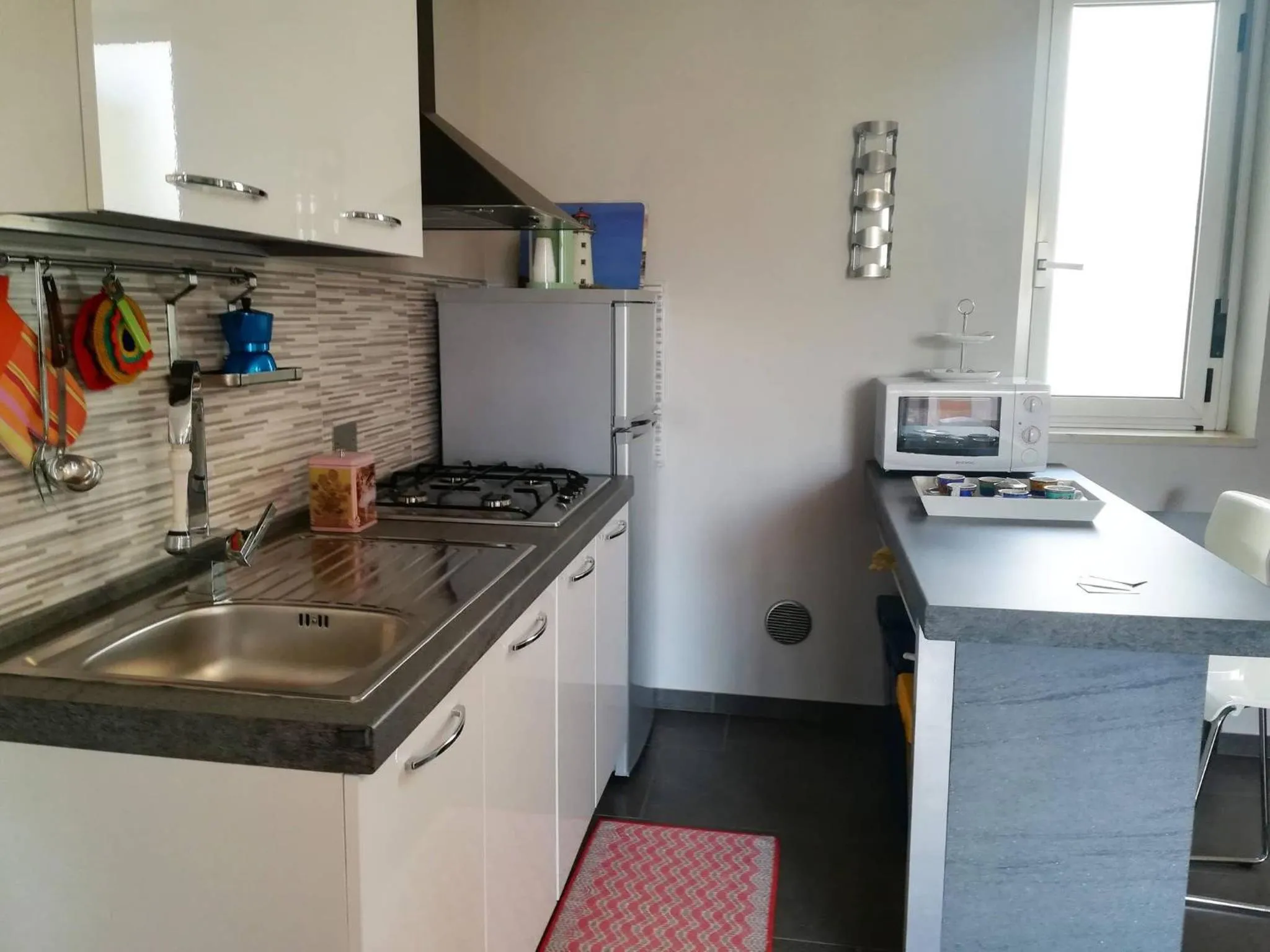 kitchen in Modern Holiday Apartment With Wi-fi, Air Conditioning And Balcony; Pets Allowed