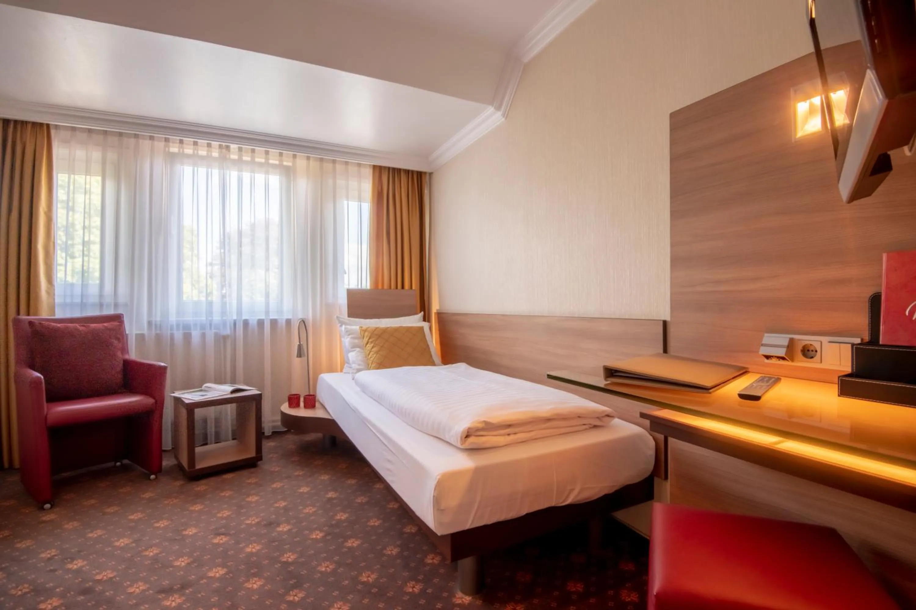 Photo of the whole room, Bed in Hotel Wegner - T h e culinary art hotel