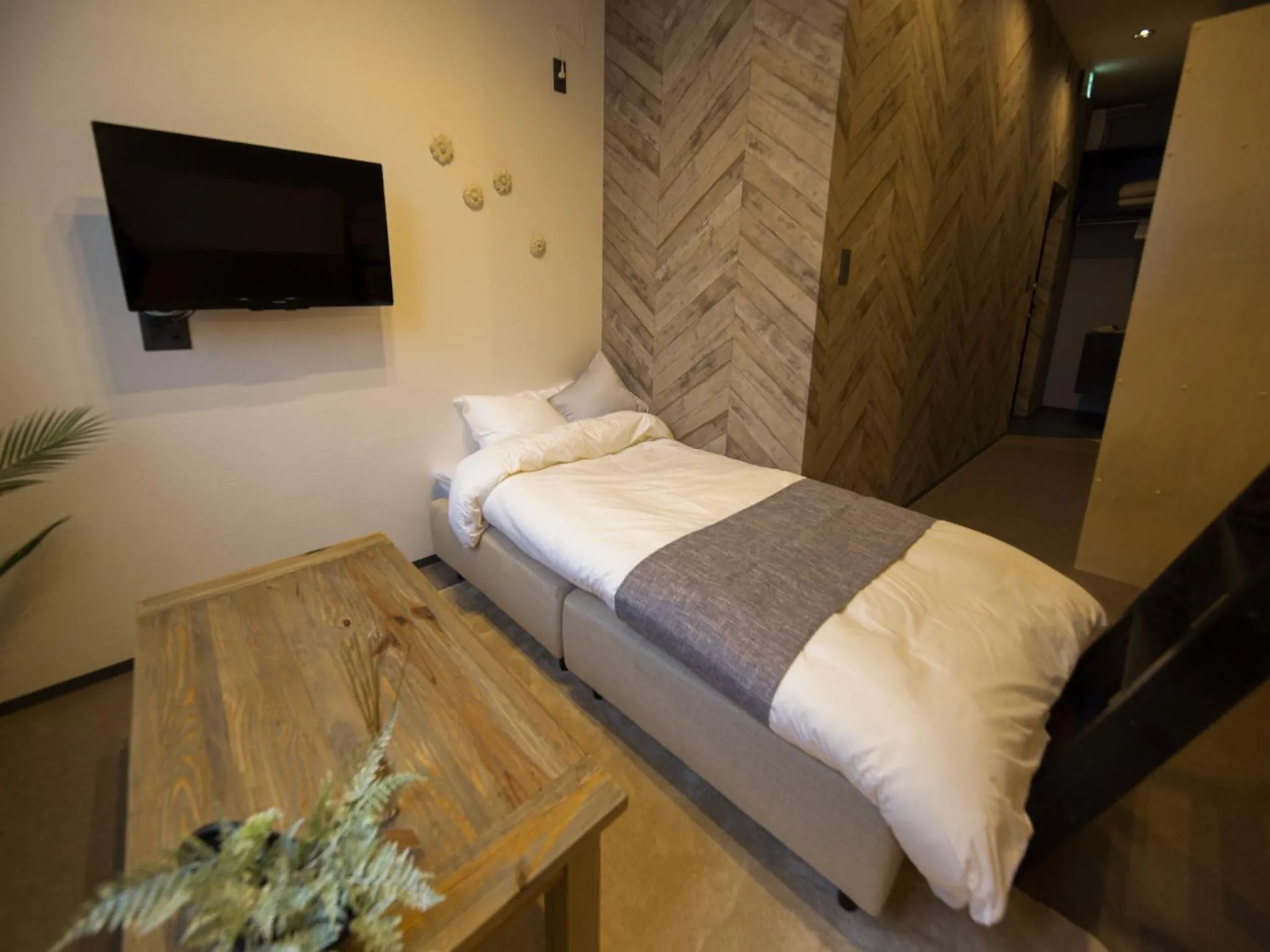 Bed in UCHI SUSUKINO WEST by Hotel Wheat