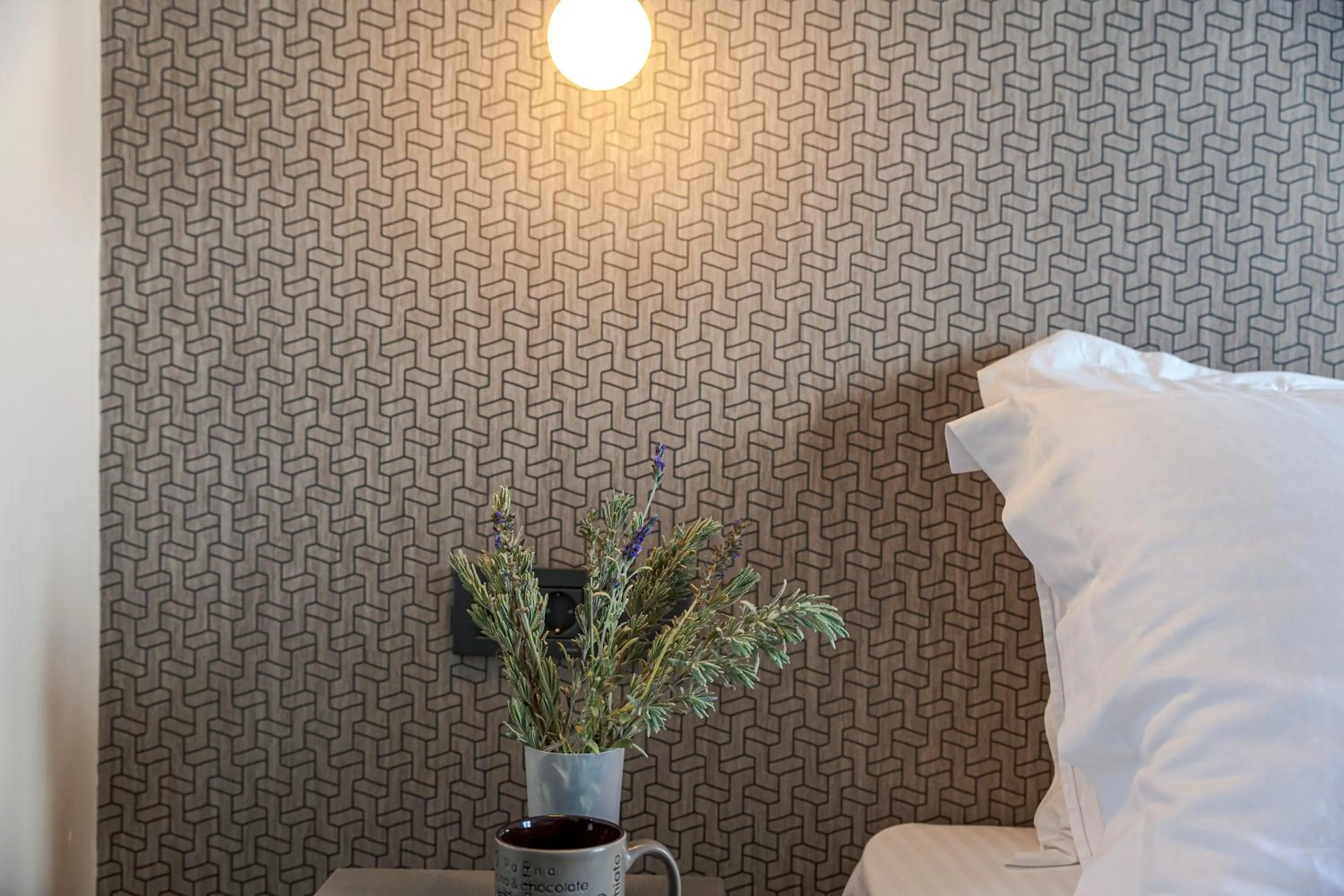 Decorative detail, Bed in Pearl Inn Hotel by Pearl Hotel Collection
