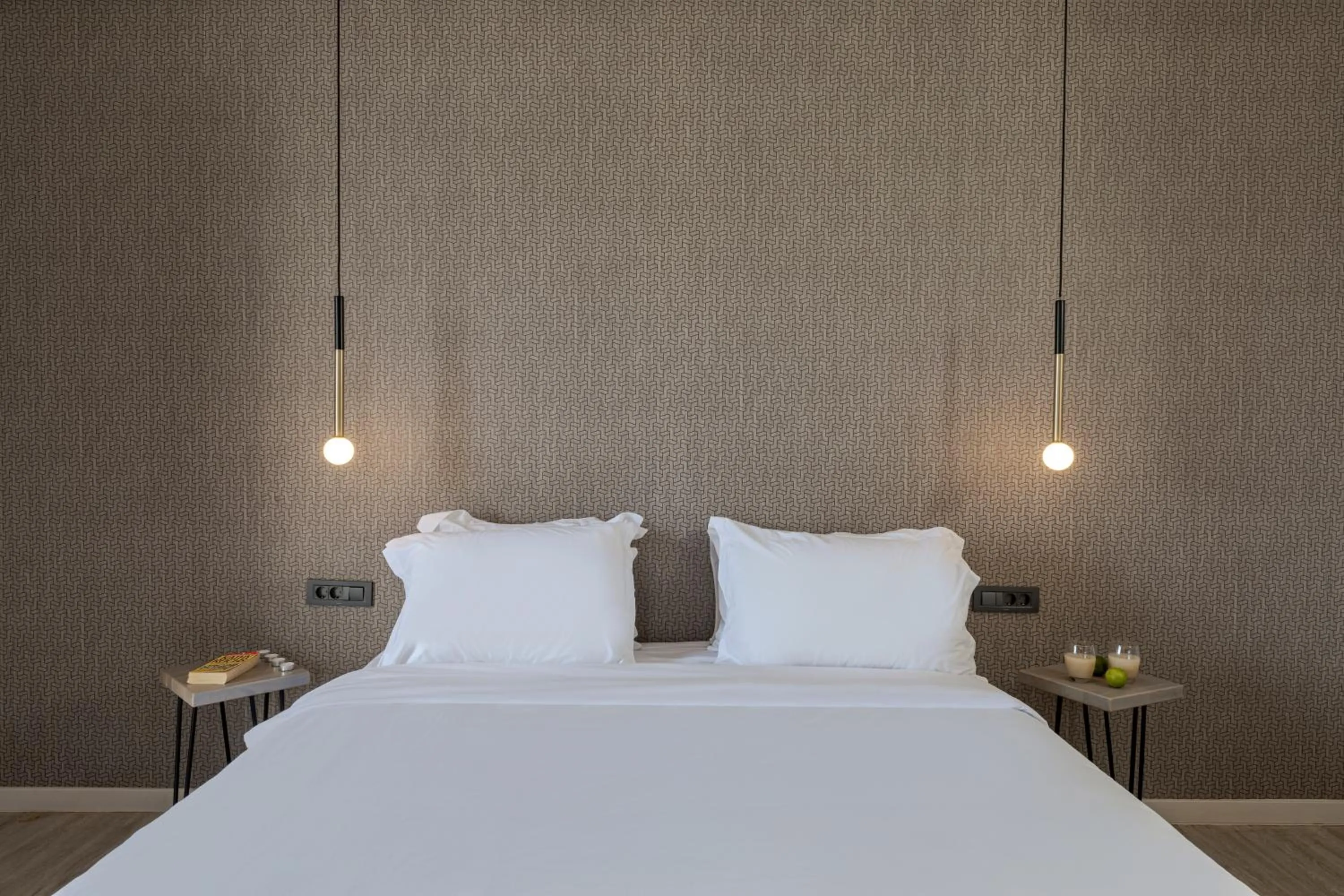 Bed in Pearl Inn Hotel by Pearl Hotel Collection