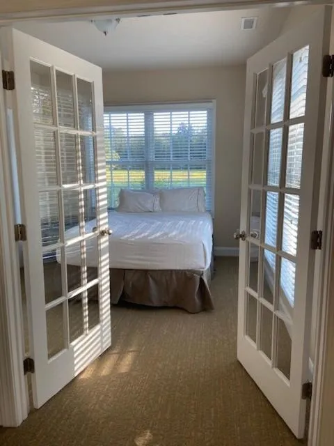 Bed in Cottages and Suites at River Landing