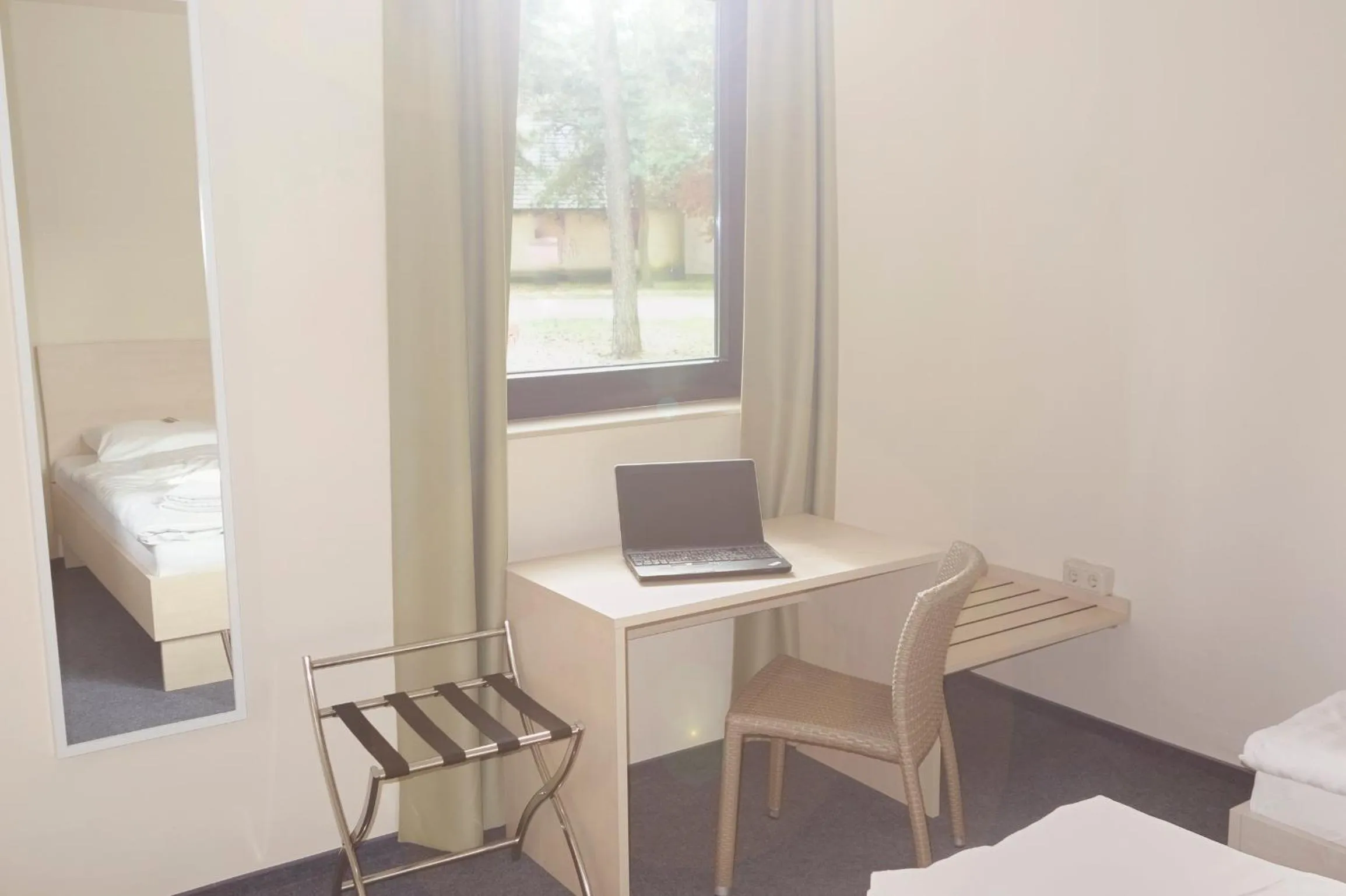 Seating area, Bed in Best Deal Airporthotel Weeze