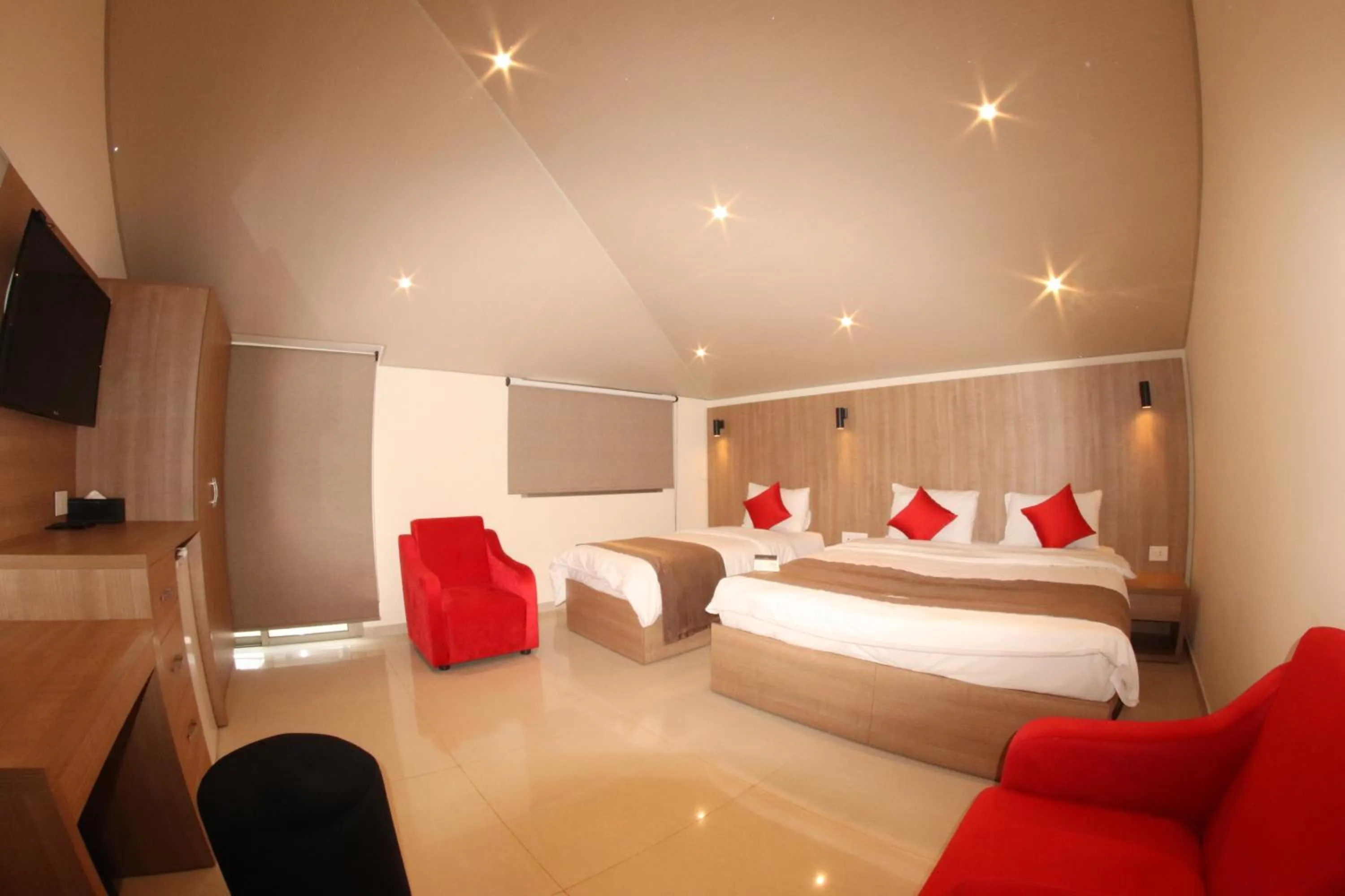 Communal lounge/ TV room, Bed in Jounieh Suites Boutique Hotel