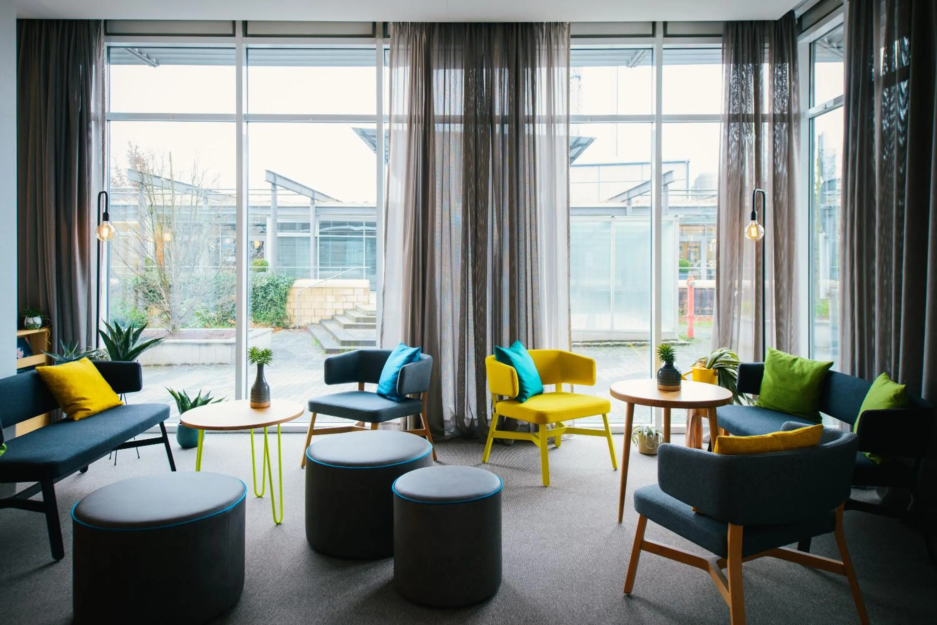 Lobby or reception in Vienna House Easy by Wyndham Bad Oeynhausen