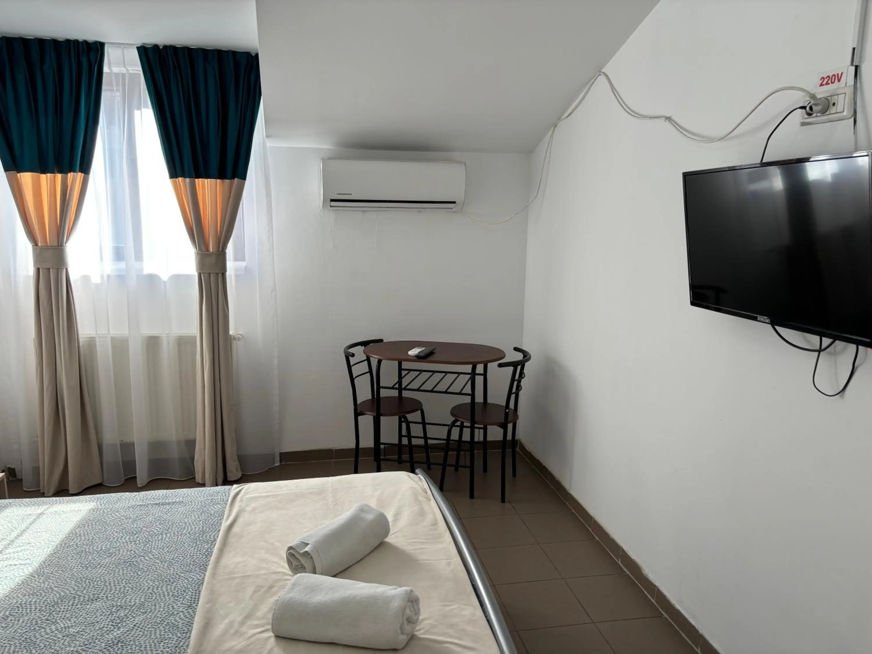 Bed in Piata Uniri Cozy Inn