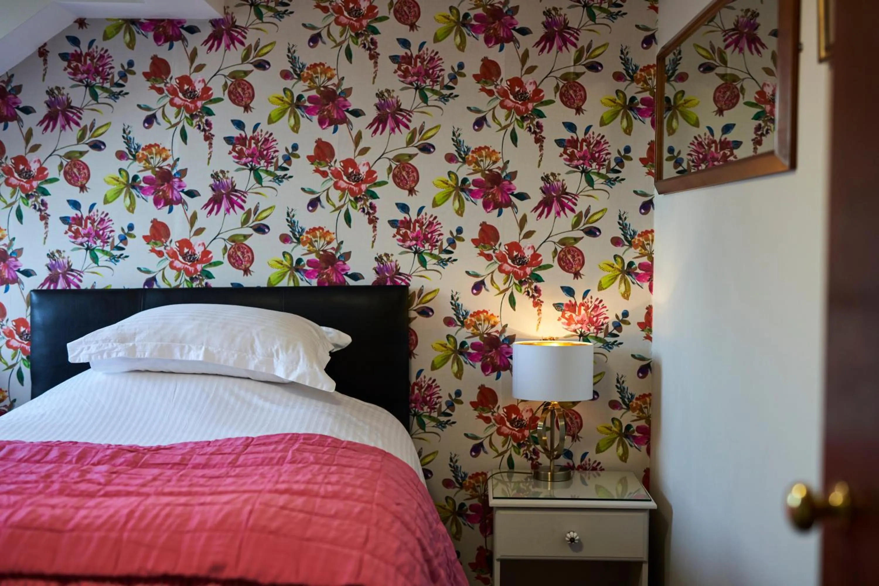 Bed in Quilt and Croissants Guest House