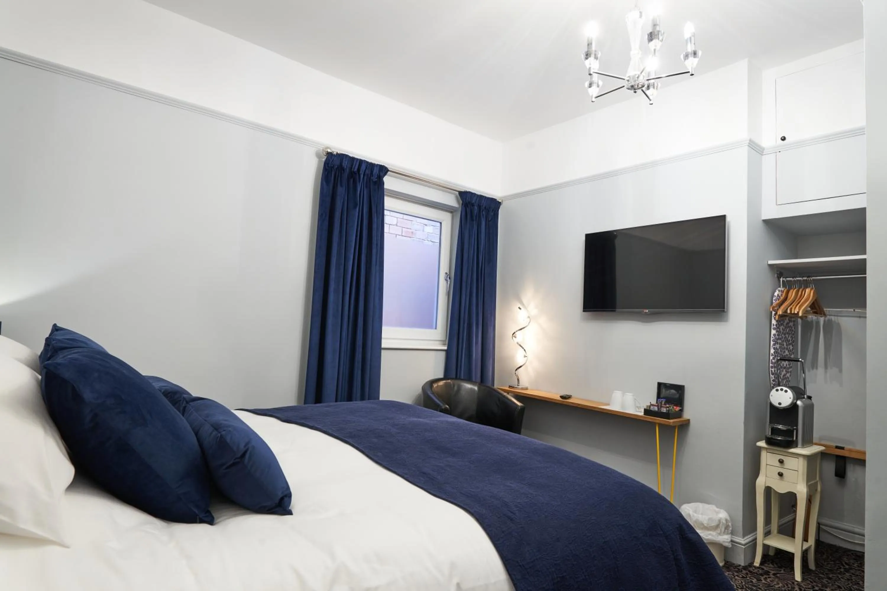 Photo of the whole room, Bed in Quilt and Croissants Guest House