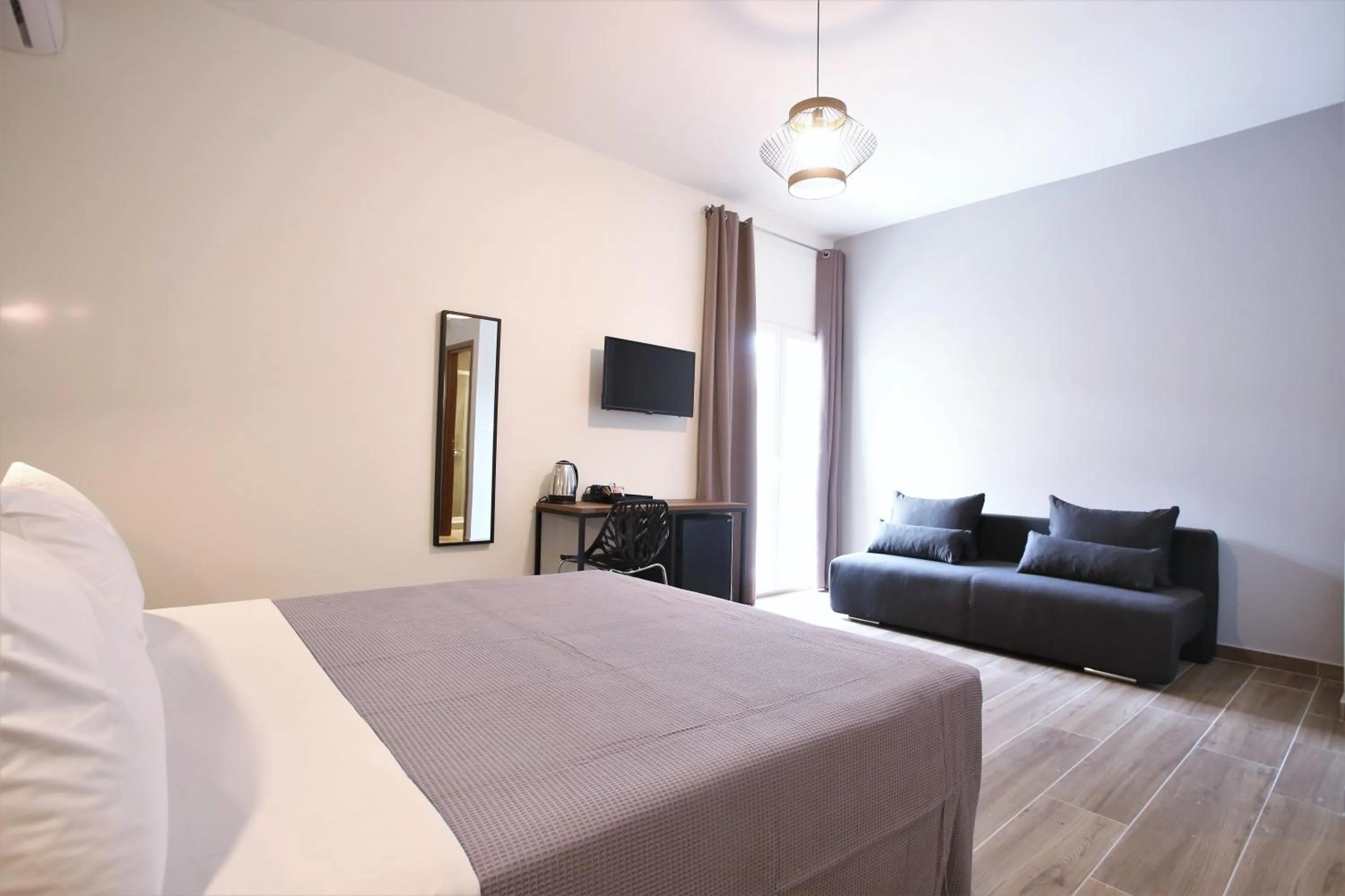 Photo of the whole room, Bed in Aethon Airport Project-FREE SHUTTLE by GK Properties