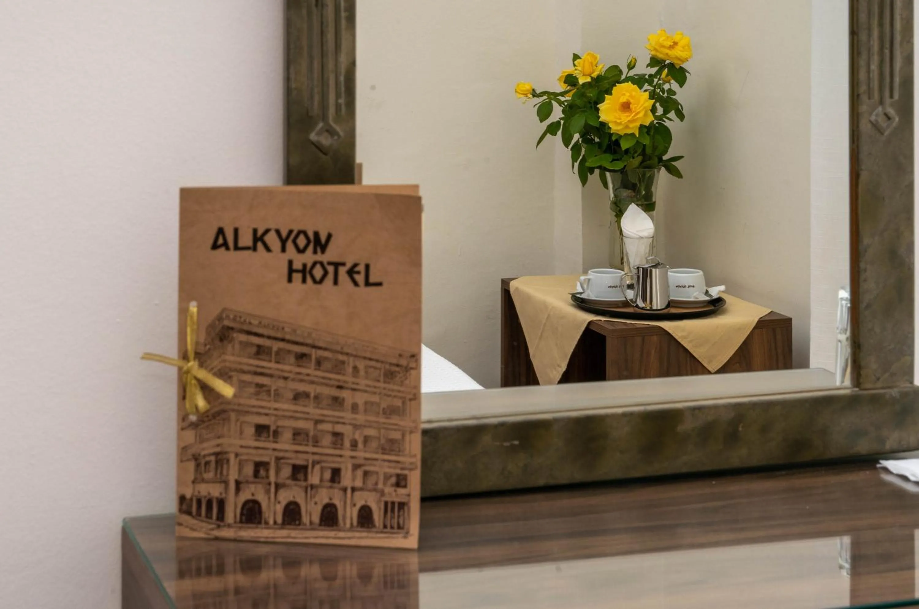 Property logo or sign in Hotel Alkyon