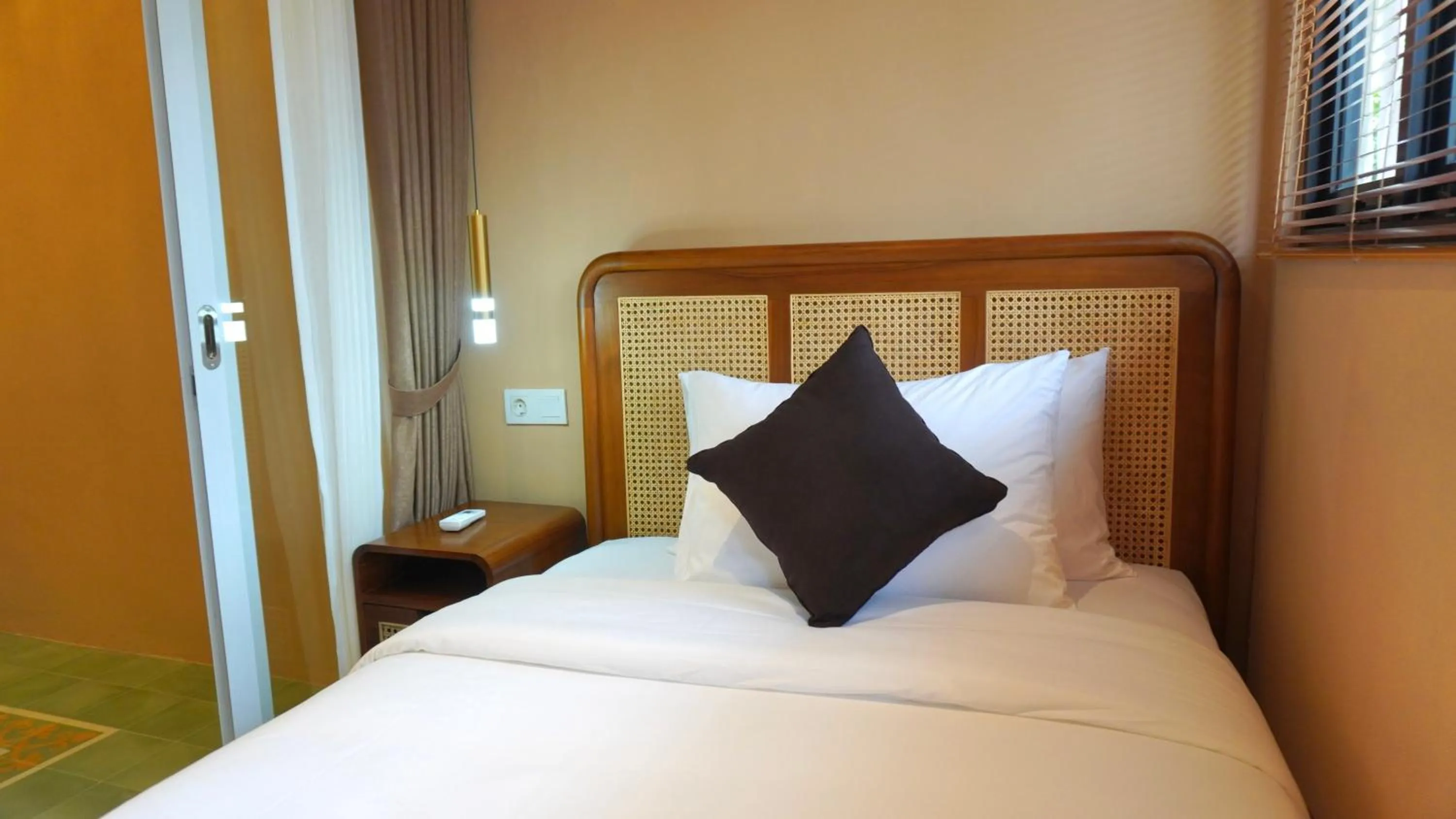 Bed in Luxury Malioboro Hotel