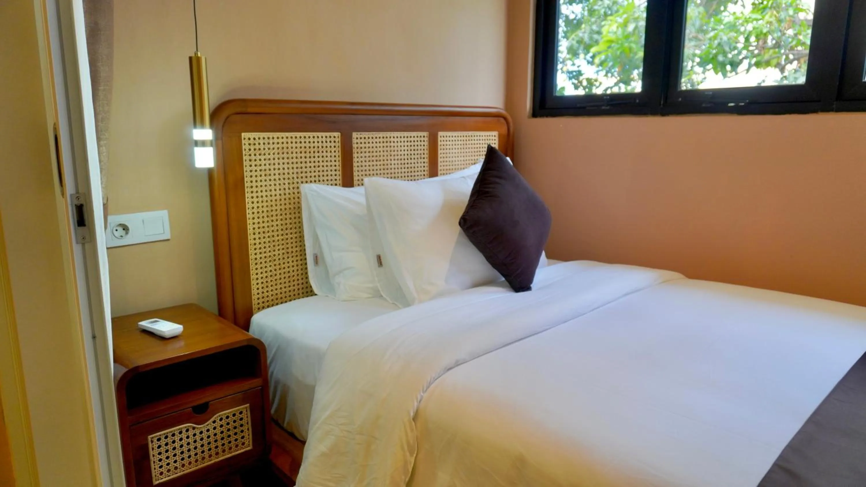 Bed in Luxury Malioboro Hotel