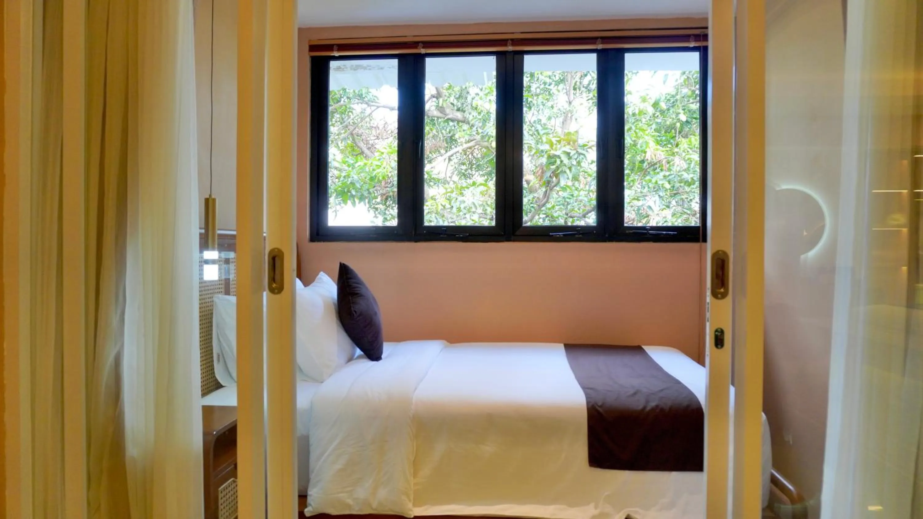 Bed in Luxury Malioboro Hotel