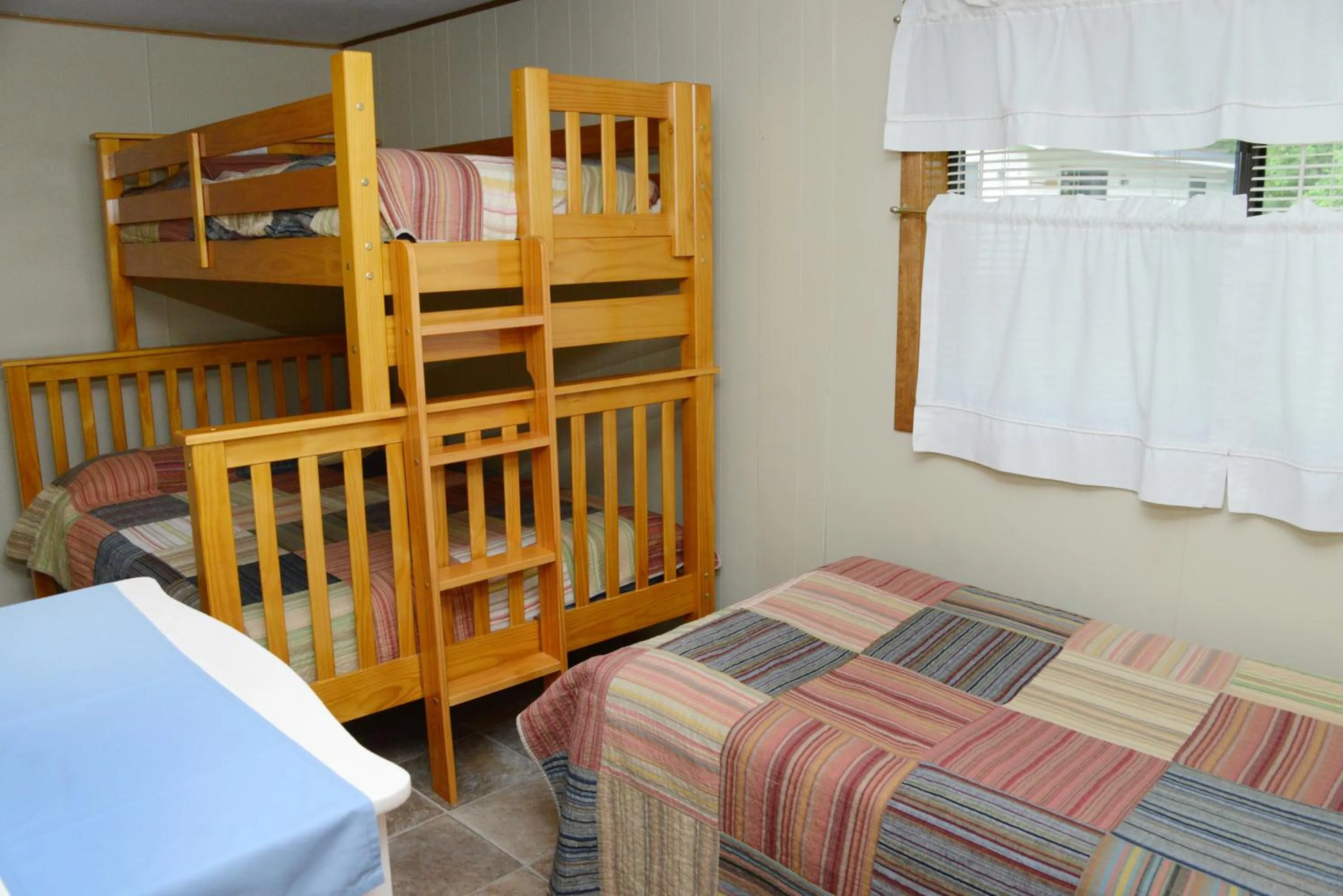 Seating area, Bed in Riverside Resort