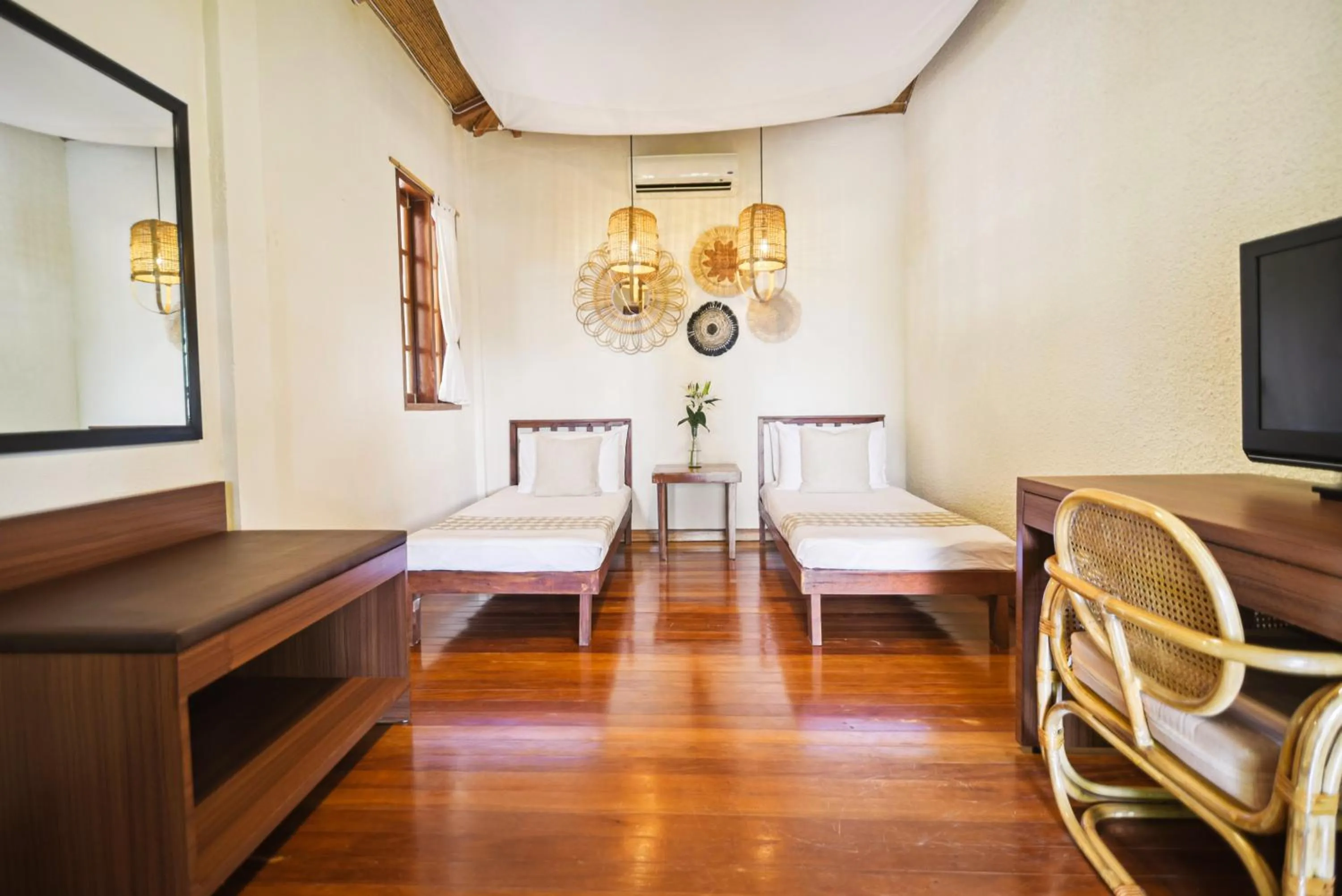 Bed in The Strand Boutique Resort