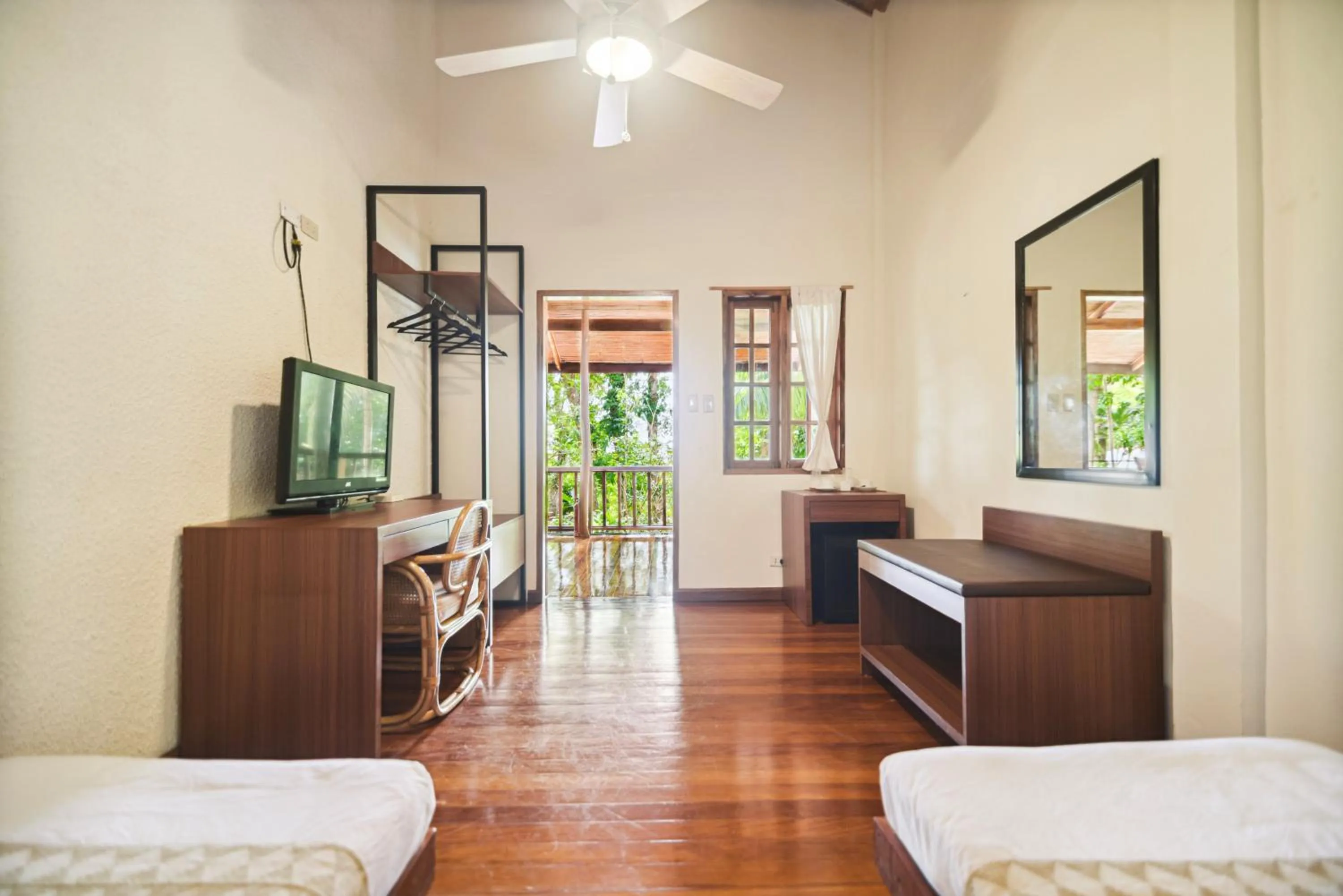 Bed in The Strand Boutique Resort