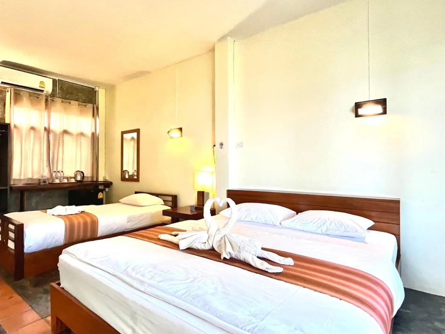 Bed in The Chevalley Beach Resort