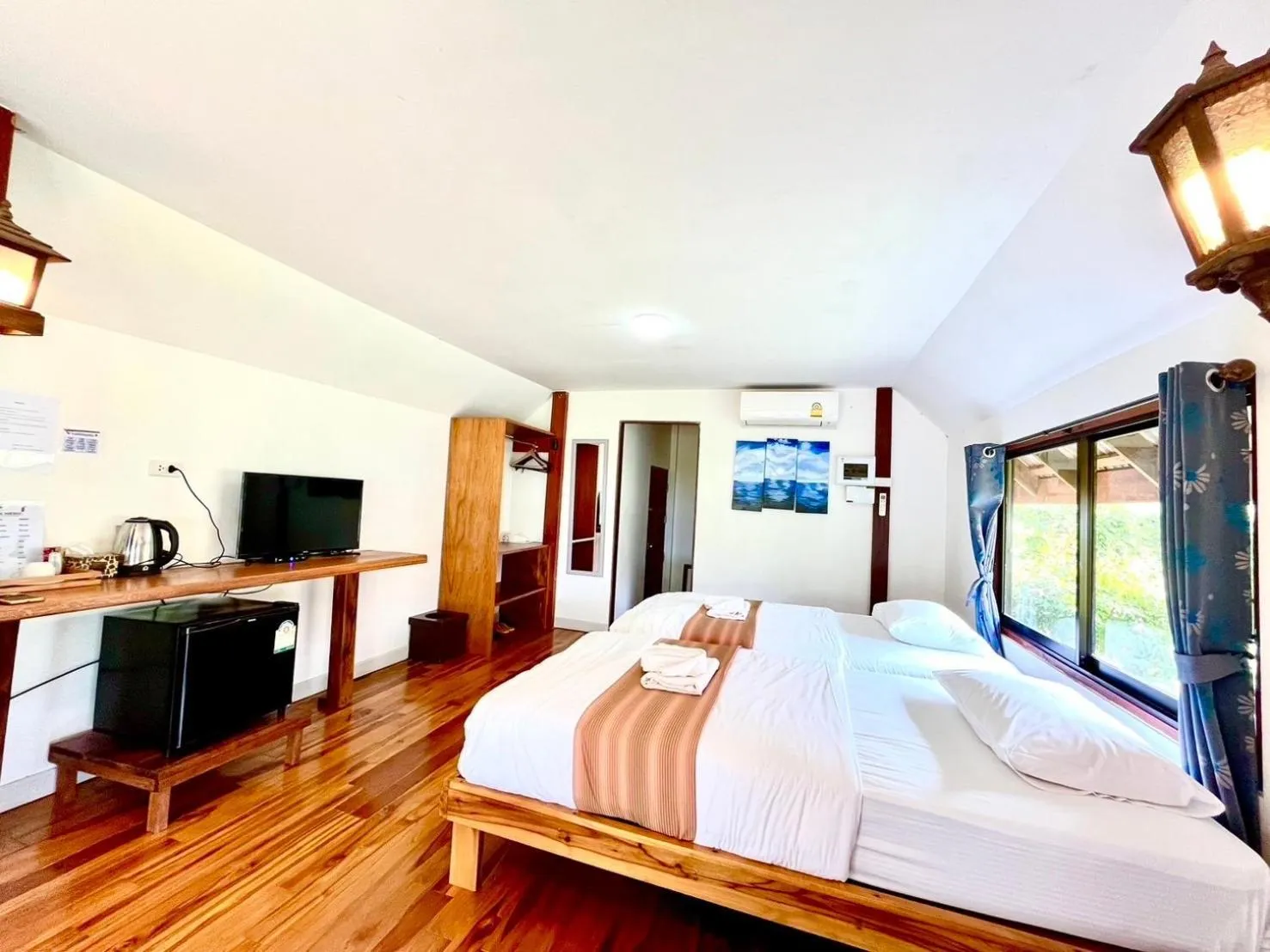 Bed in The Chevalley Beach Resort