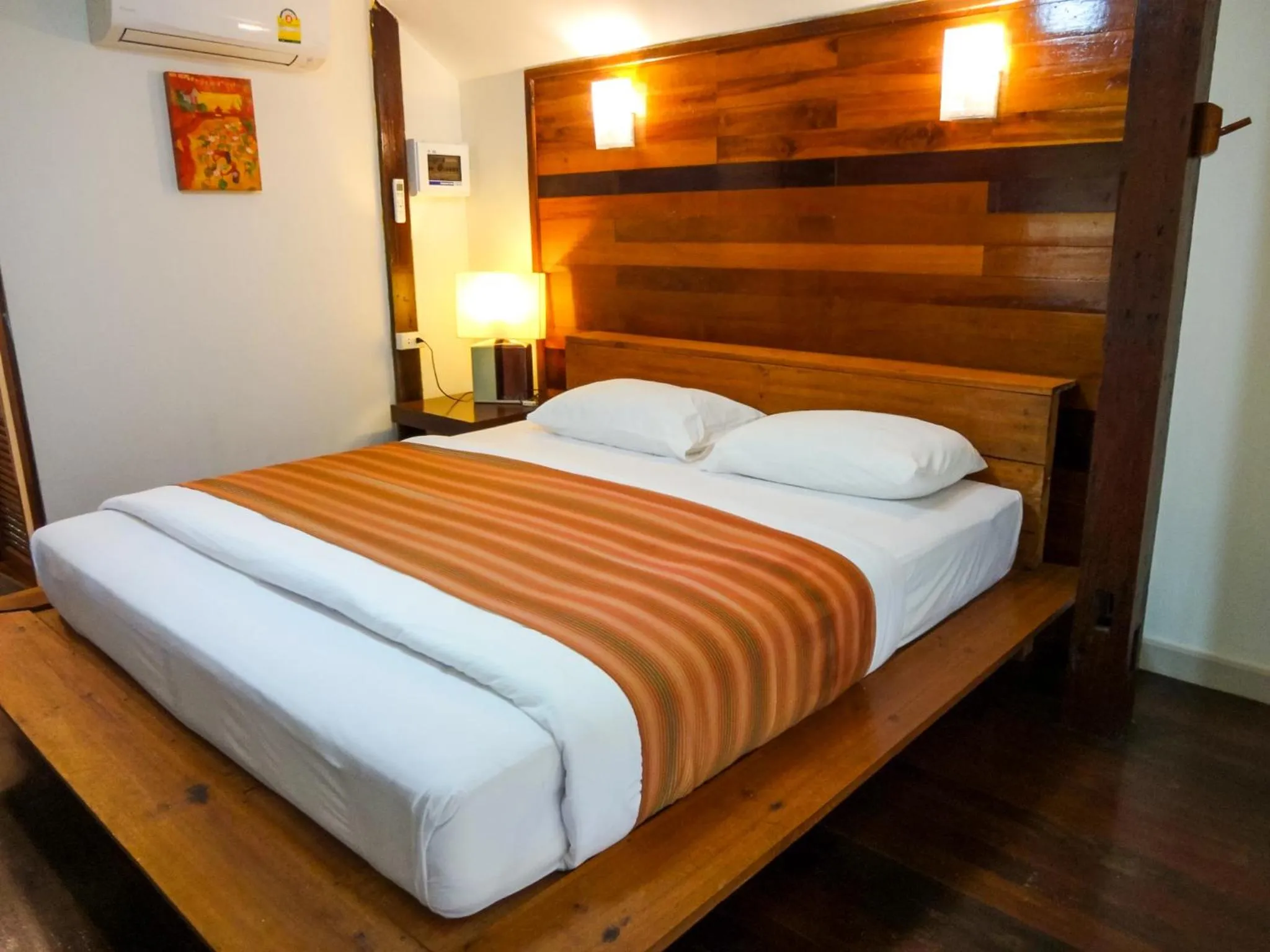 Bed in The Chevalley Beach Resort