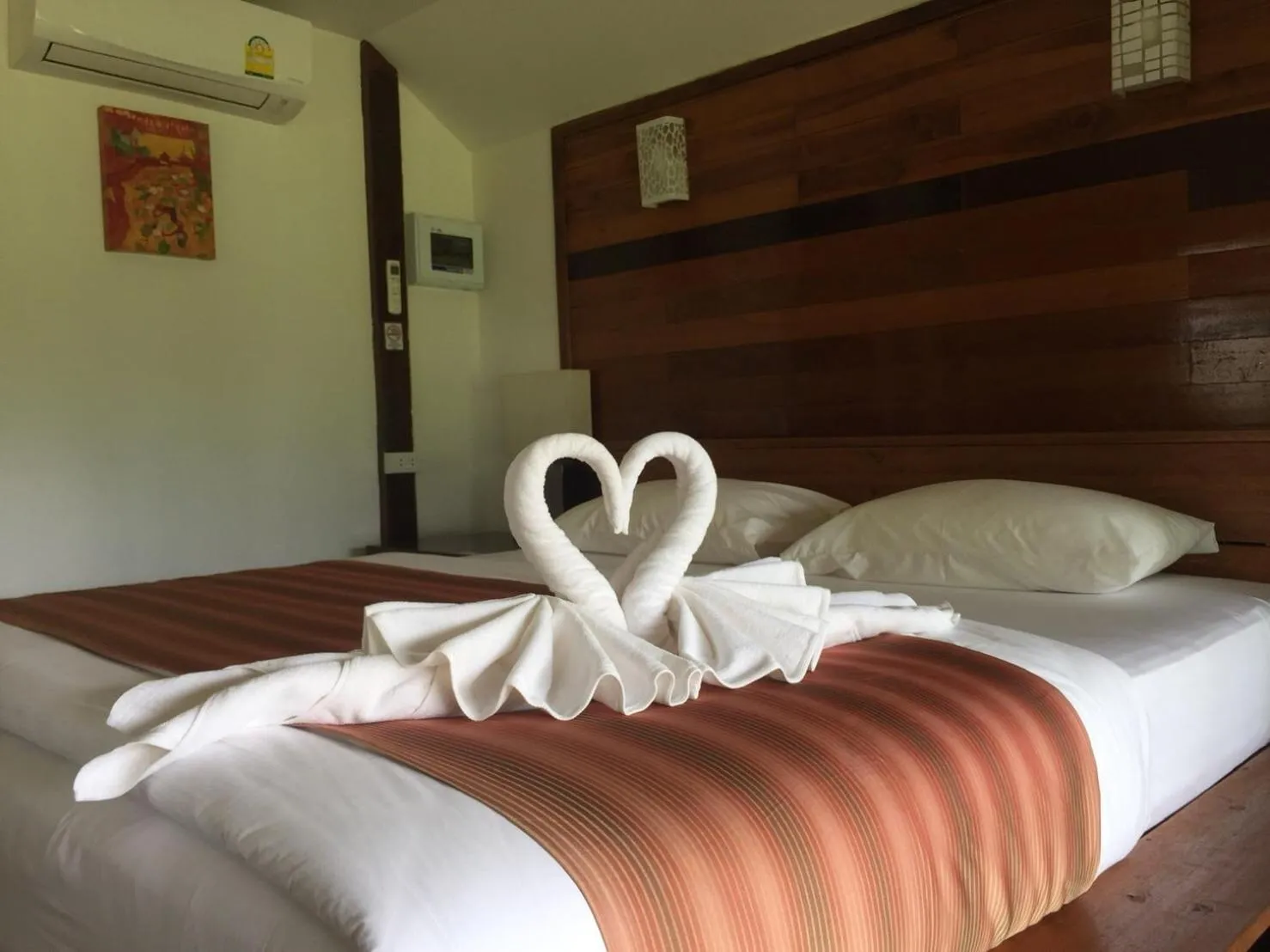 Bed in The Chevalley Beach Resort