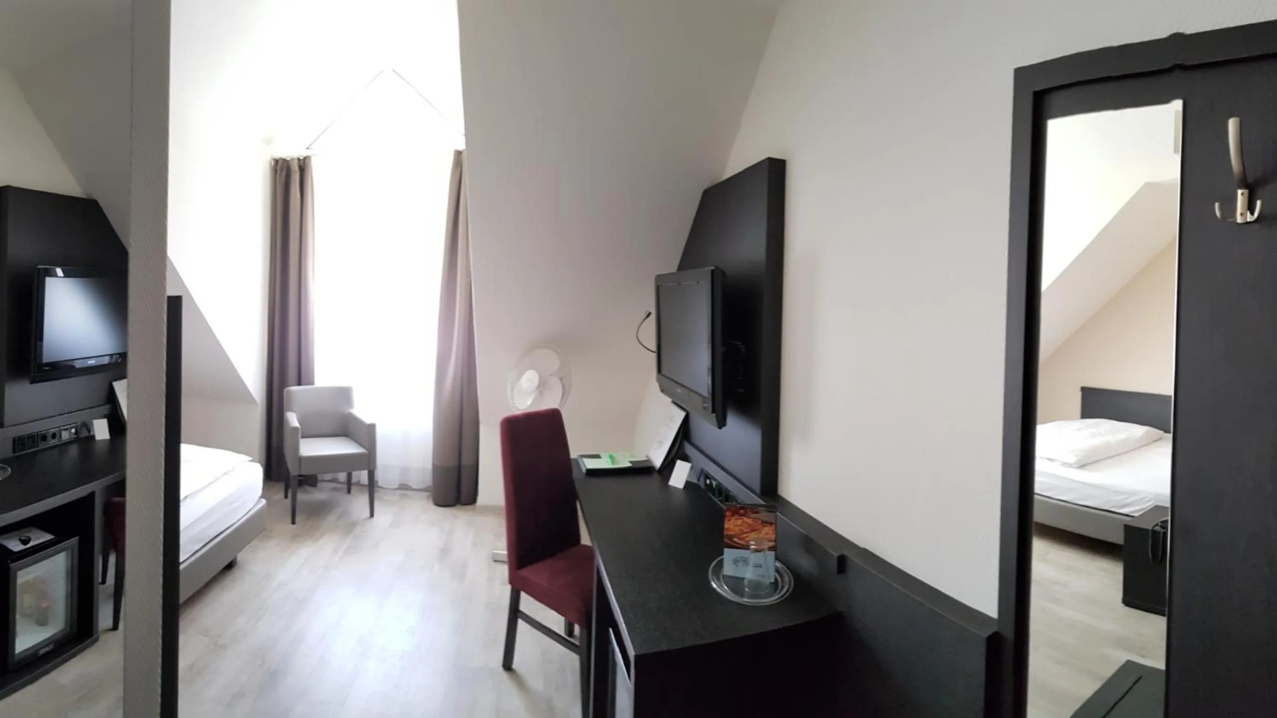 Seating area, Bed in Astralis Hotel Domizil