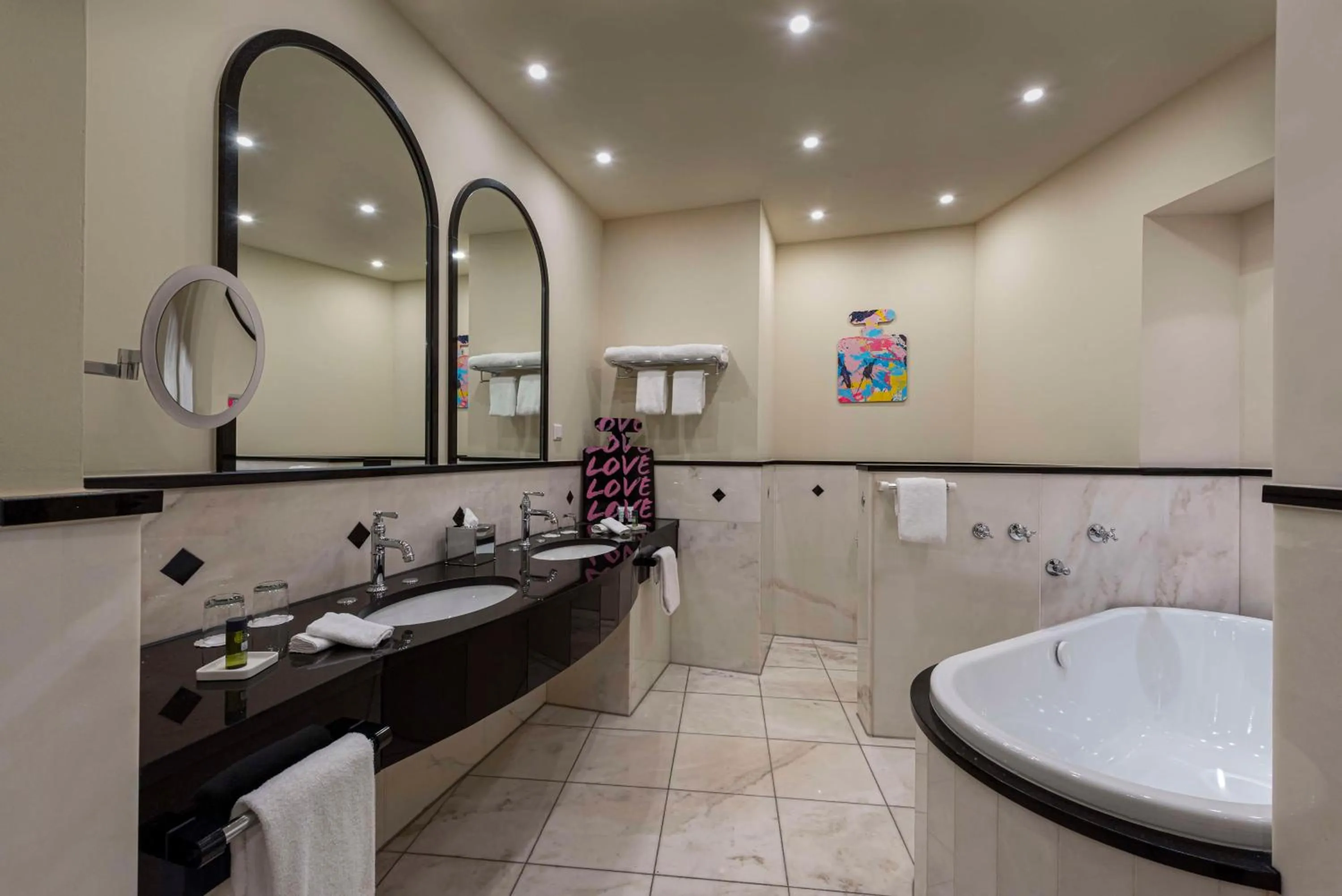 Bathroom in Wasserturm Hotel Cologne, Curio Collection by Hilton