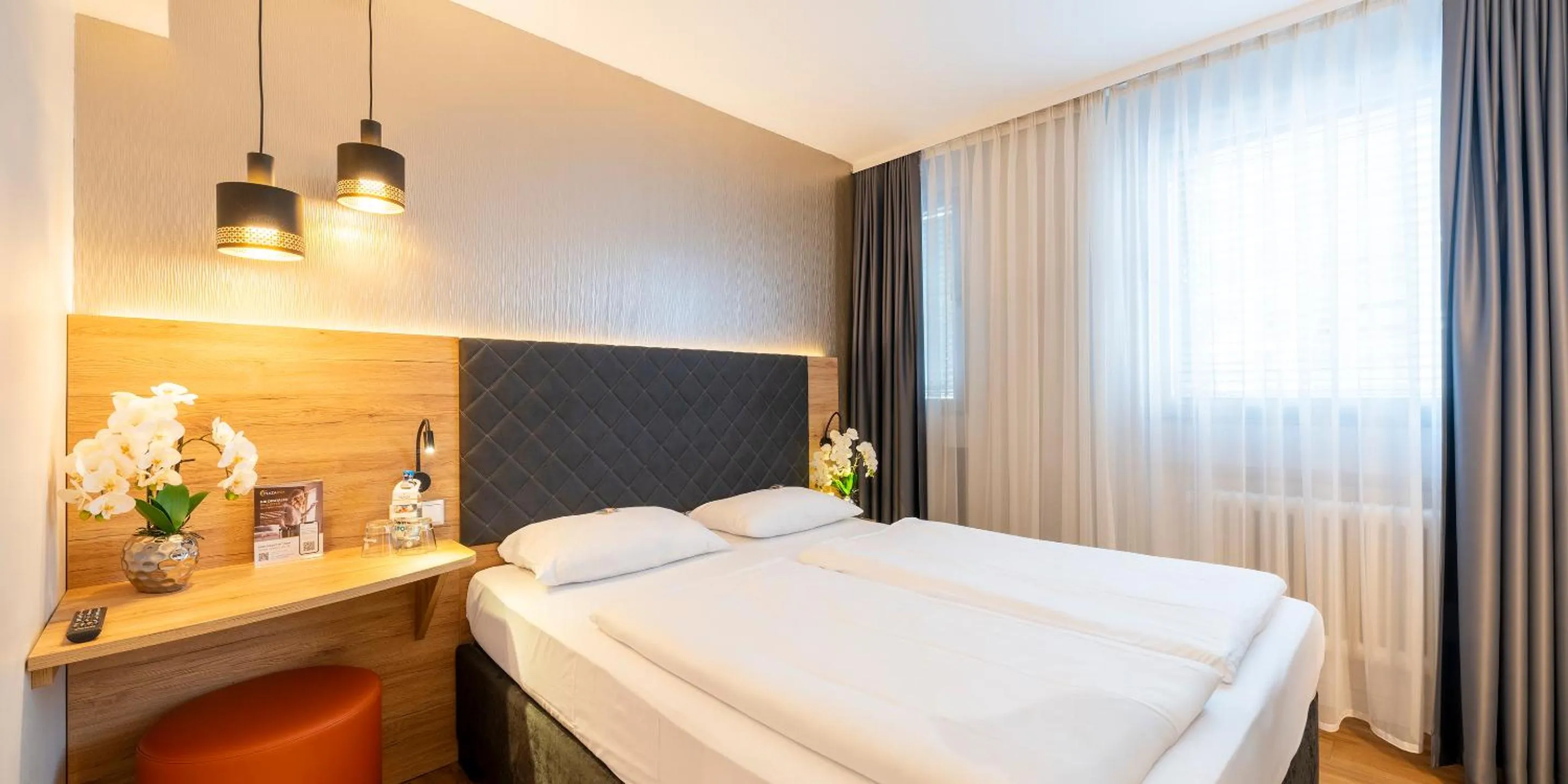 Bed in PLAZA INN Rieker Stuttgart Hauptbahnhof