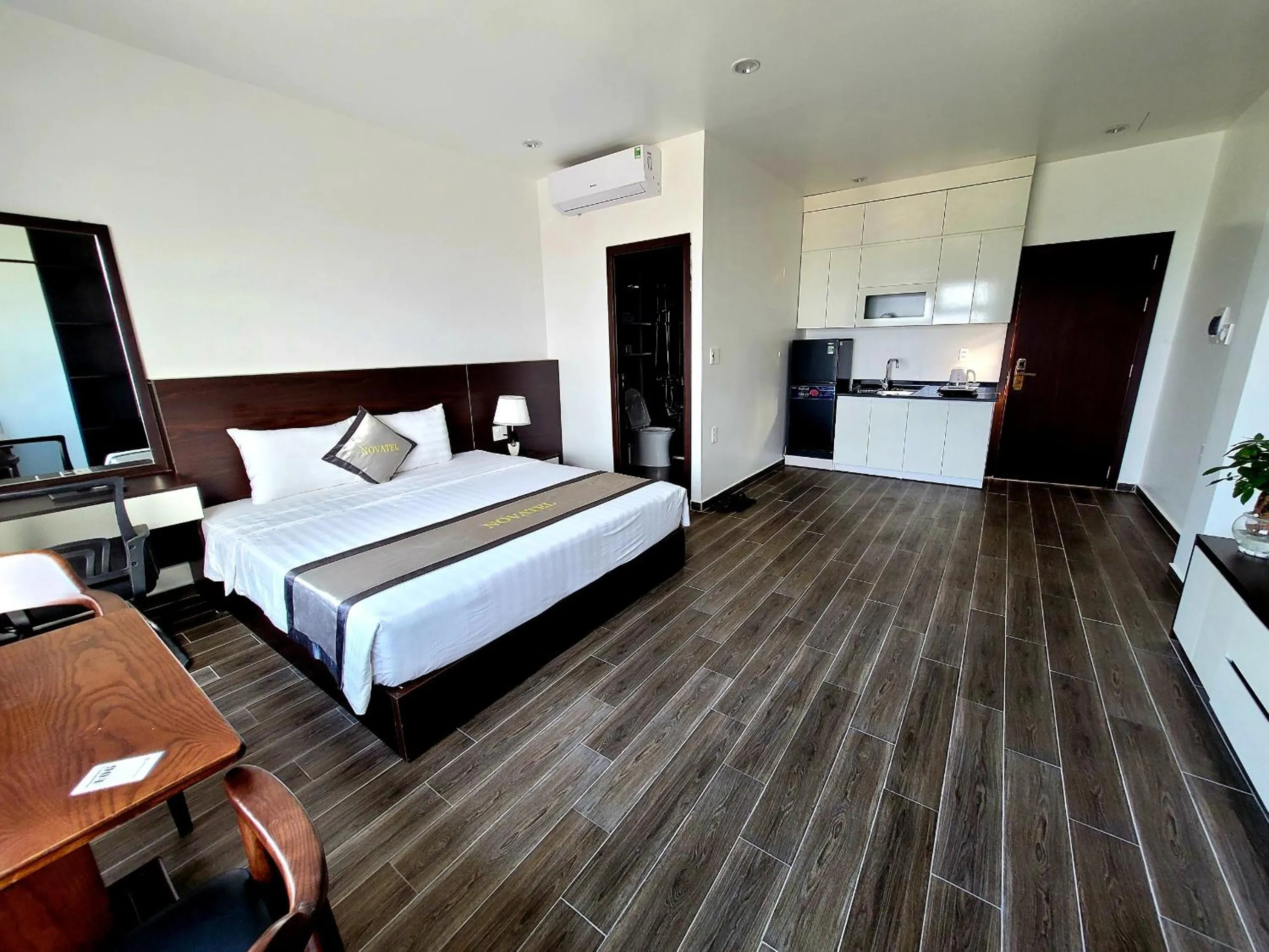 Bed in The Nova Hotel & Apartment