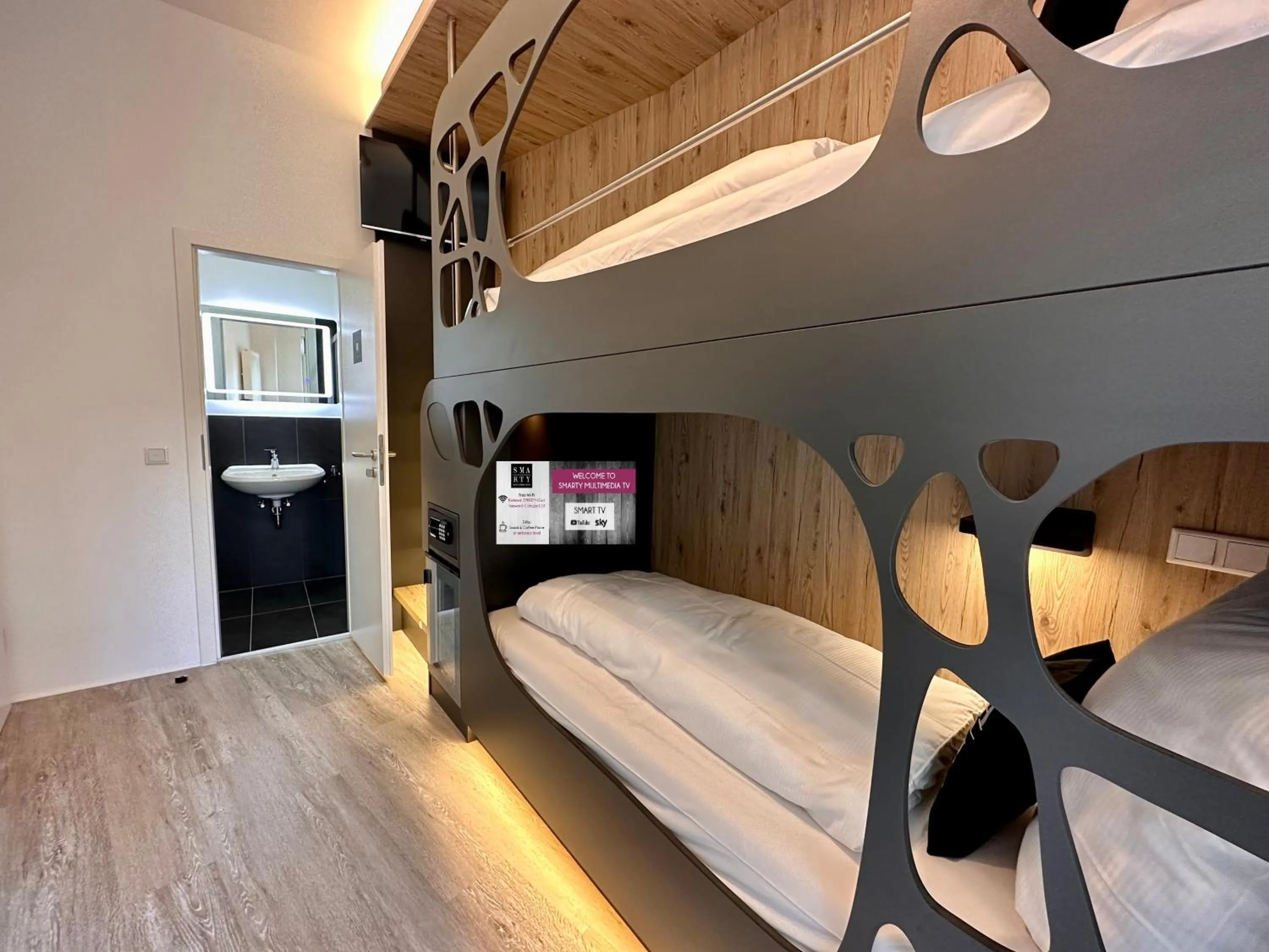 Photo of the whole room, Bed in SMARTY Cologne Dom Hotel - Boardinghouse - KONTAKTLOSER SELF CHECK-IN