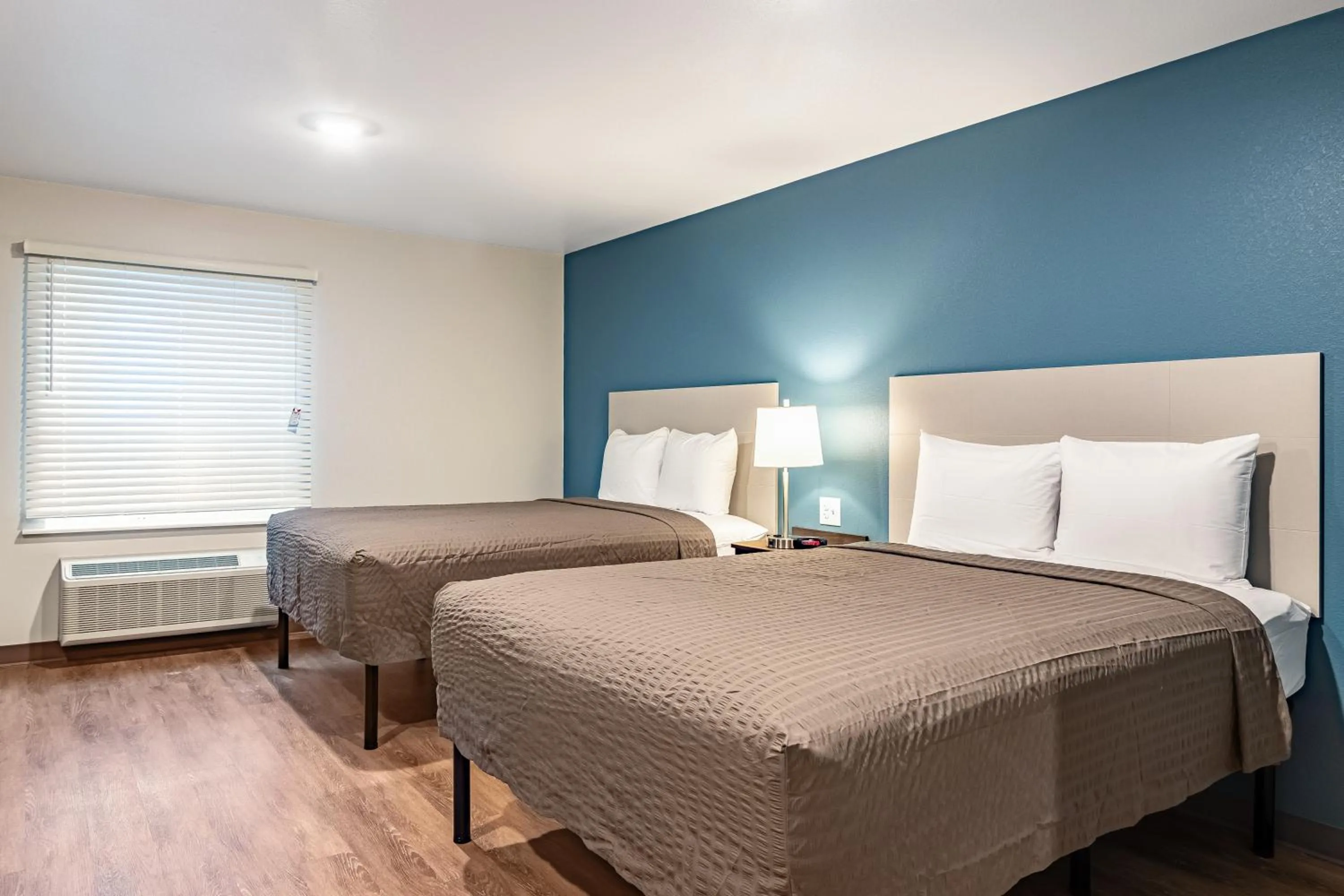 Bed in WoodSpring Suites Toledo Maumee