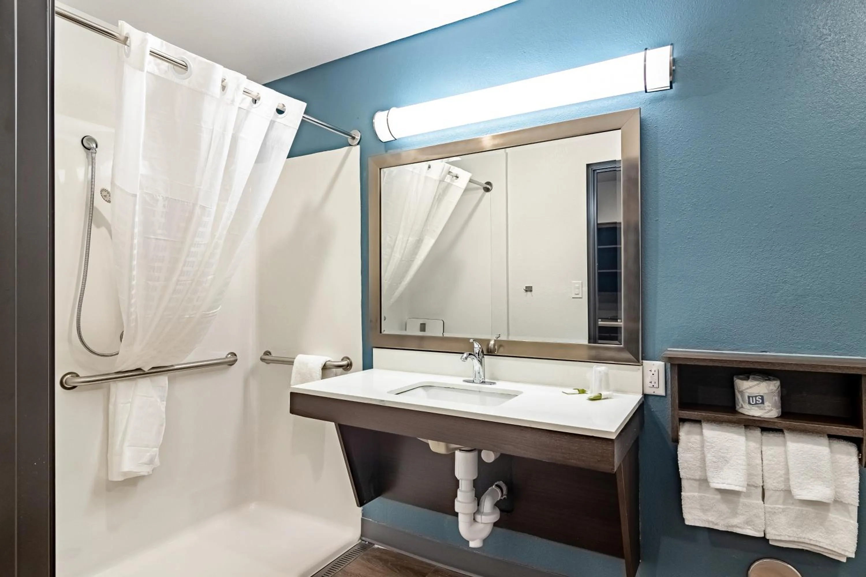 Bathroom in WoodSpring Suites Toledo Maumee