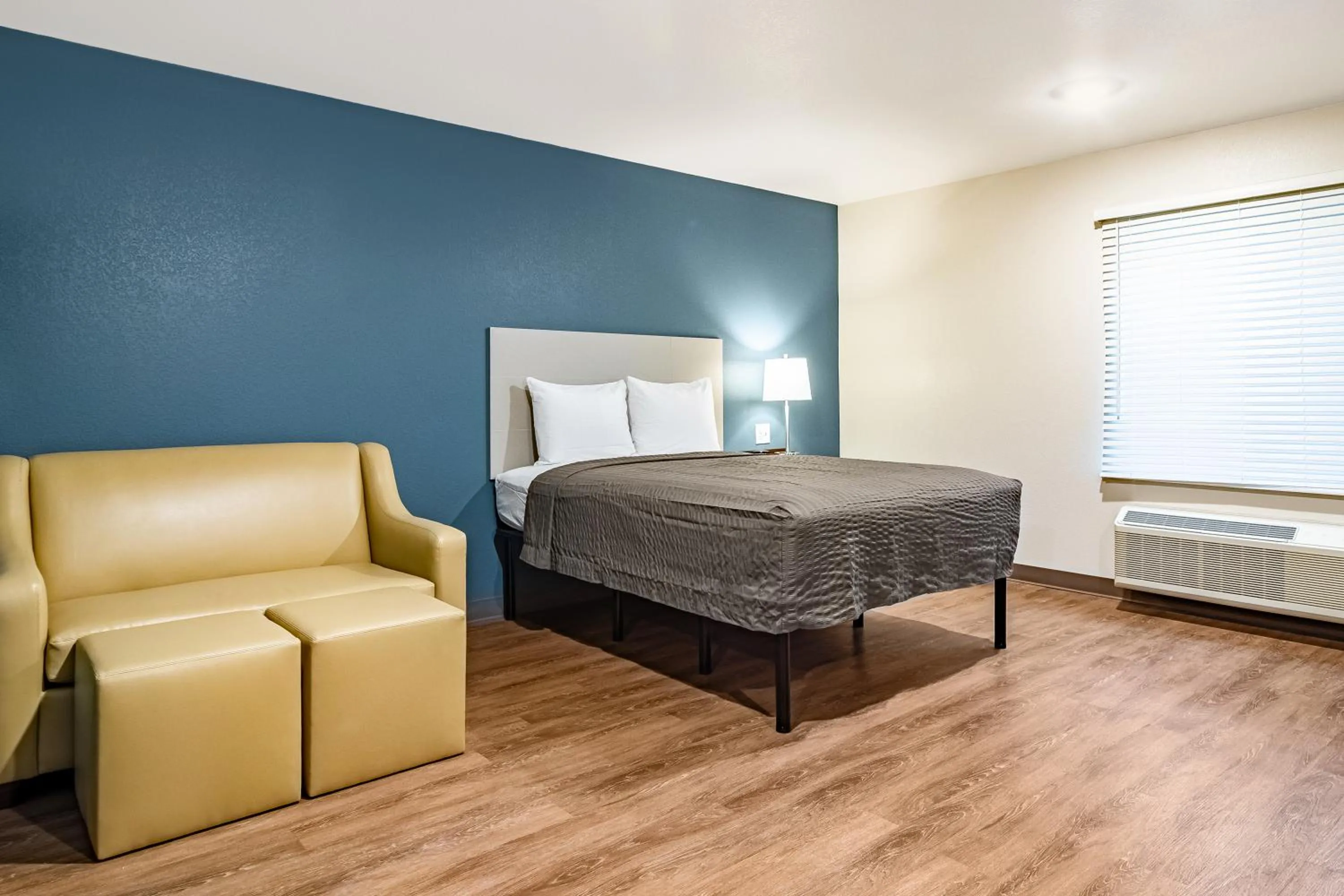Bed in WoodSpring Suites Toledo Maumee