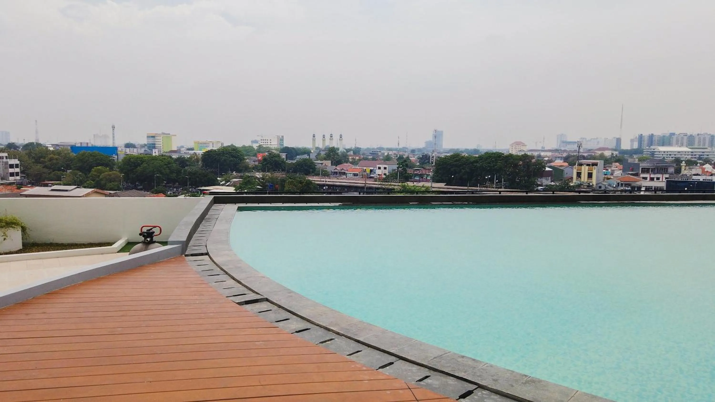 Swimming pool in Town View Apartment Studio Patraland Urbano By Travelio