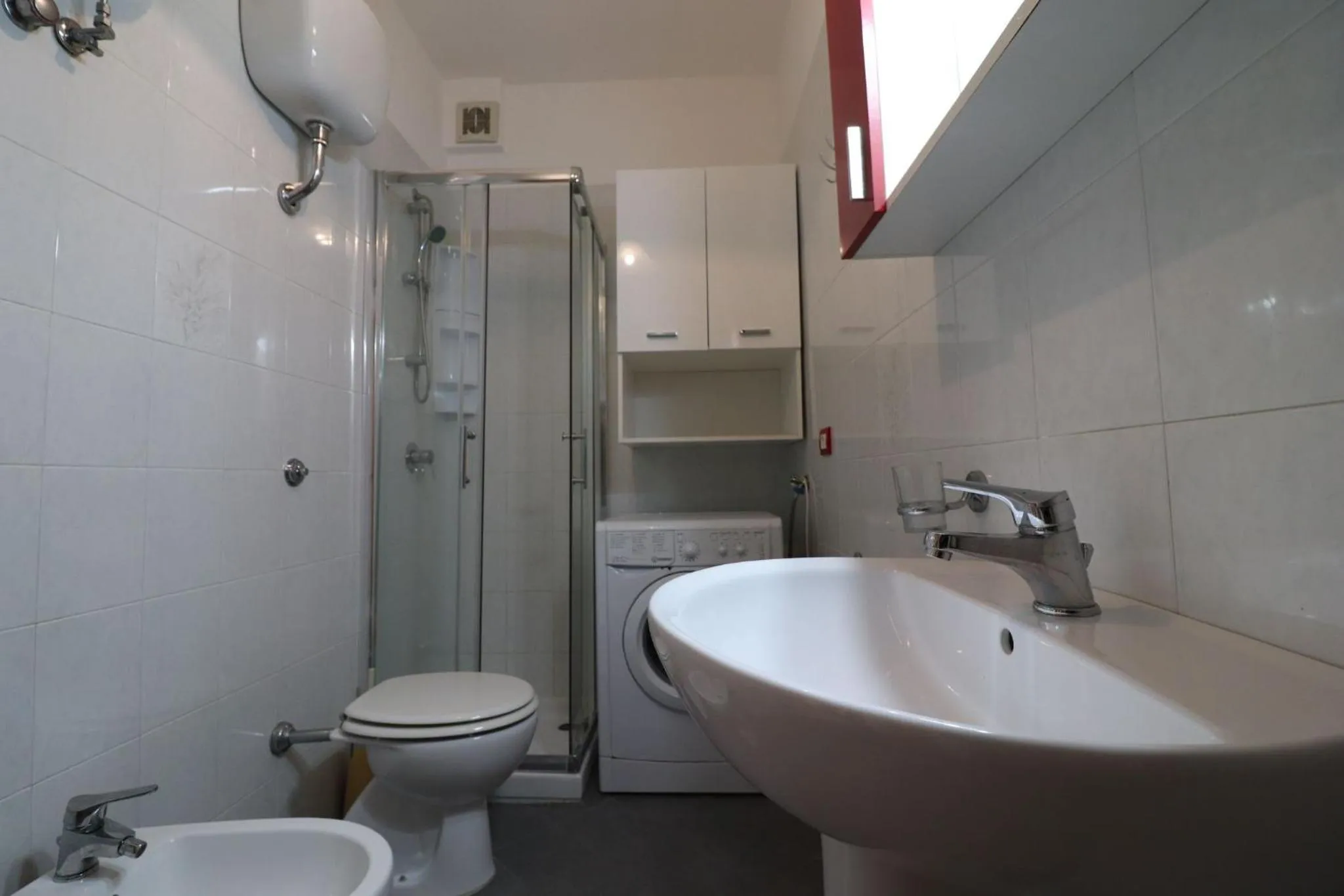 washing machine in Casa Virginia Elegant One-Bedroom Apartment Near the Beach