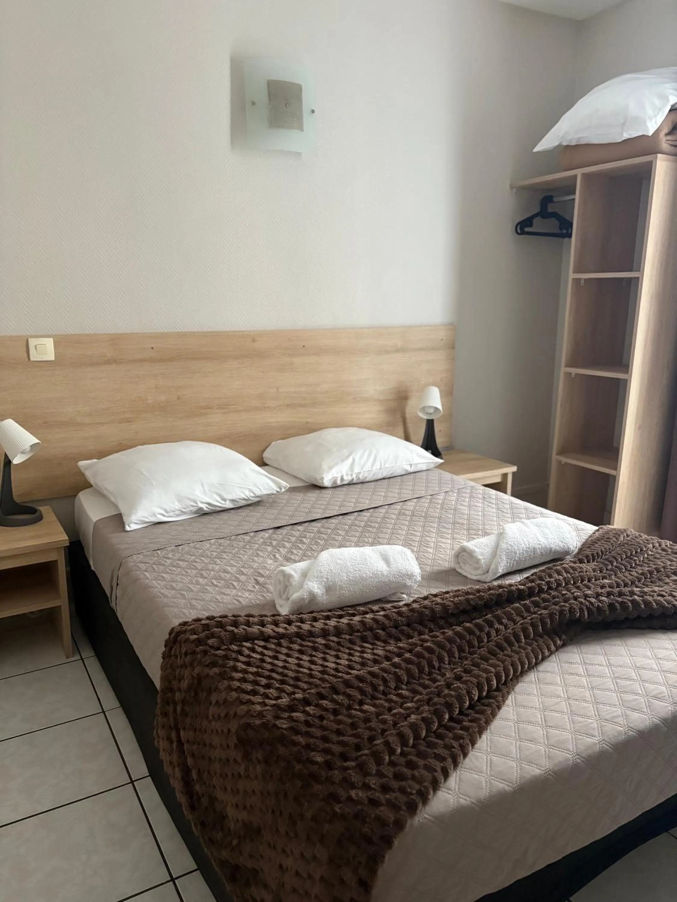 Bed in HOTEL DU MONT LOUIS