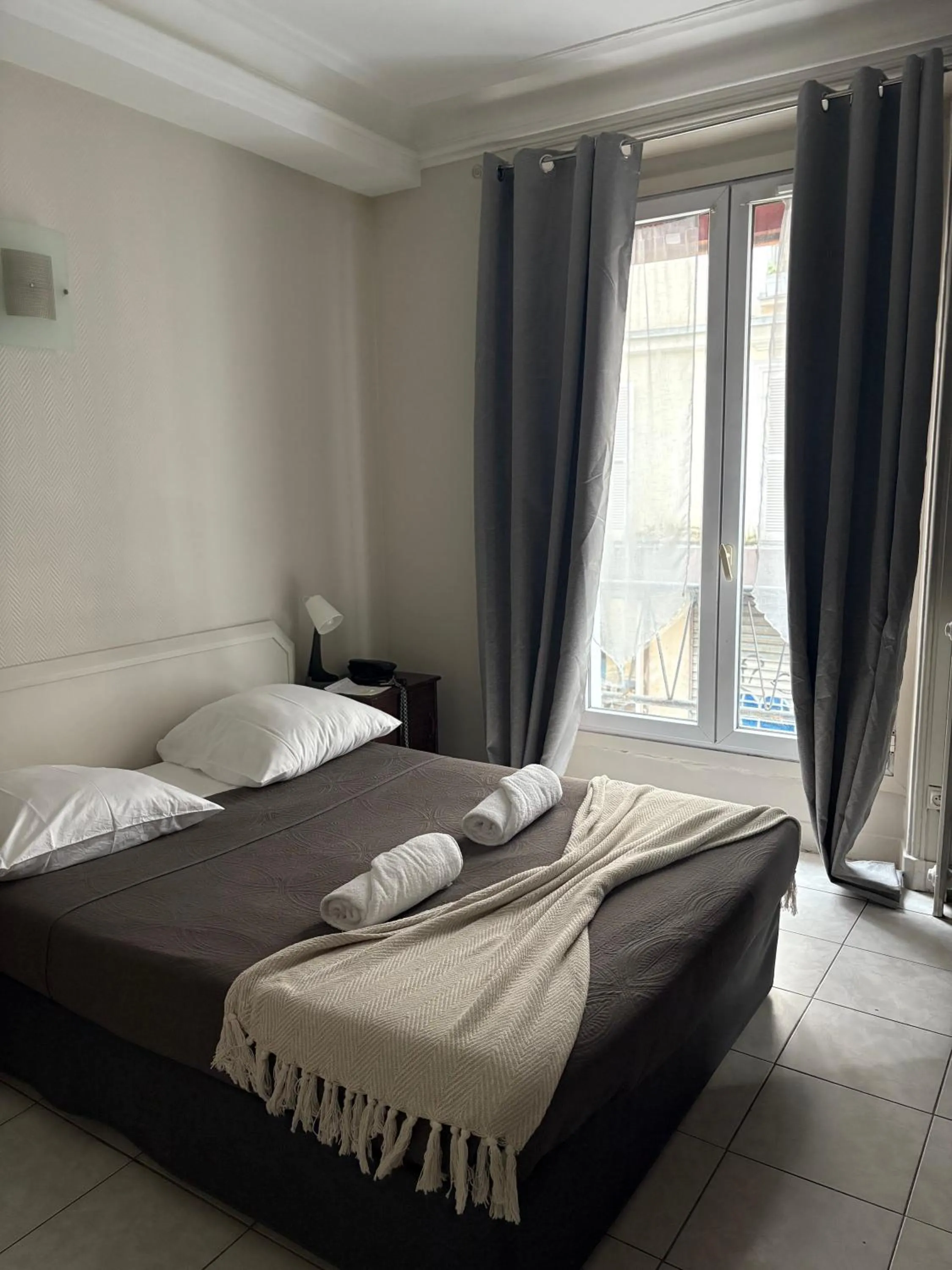 Bed in HOTEL DU MONT LOUIS