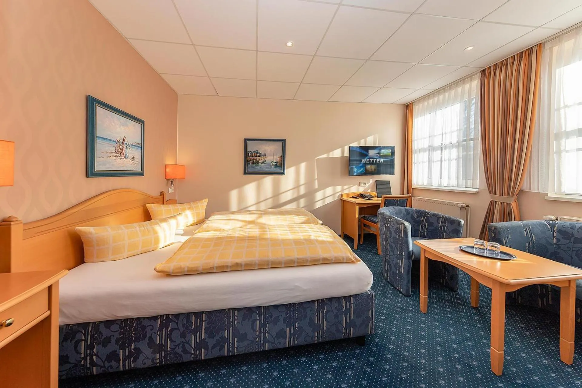 Seating area, Bed in Dünenhotel am Meer