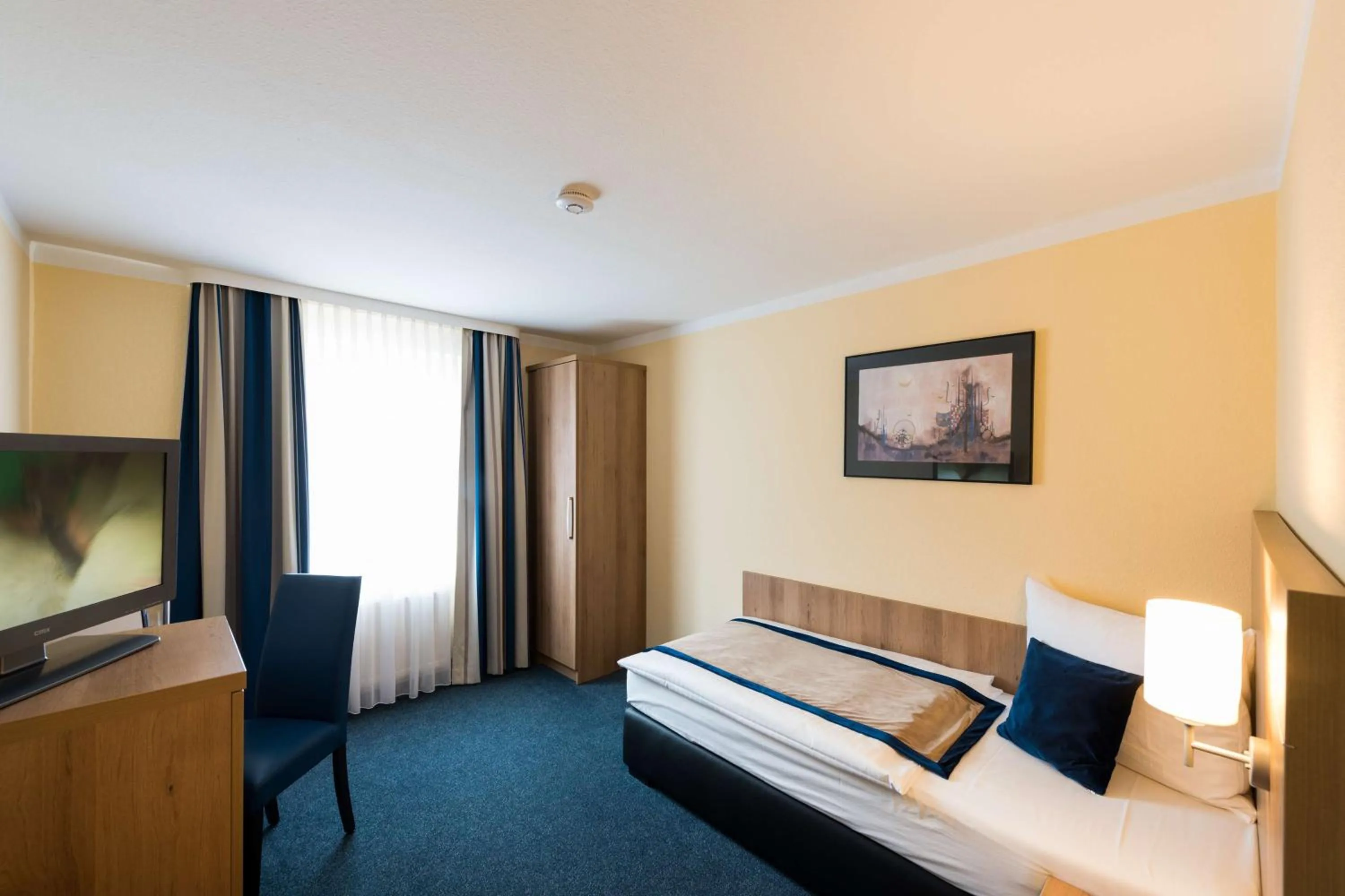 Photo of the whole room, Bed in Askania Hotel & Brauhaus