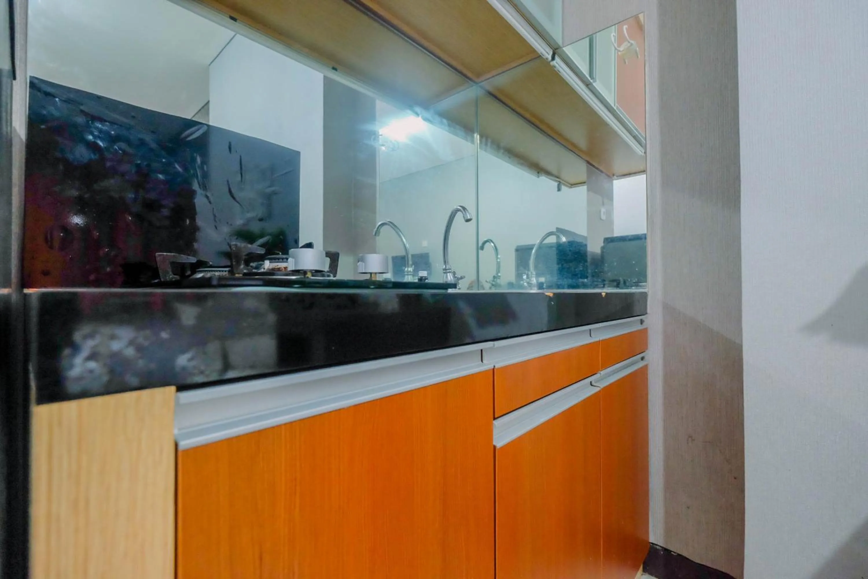 Kitchen or kitchenette in Vintage Studio Apartment at Nifarro Park By Travelio