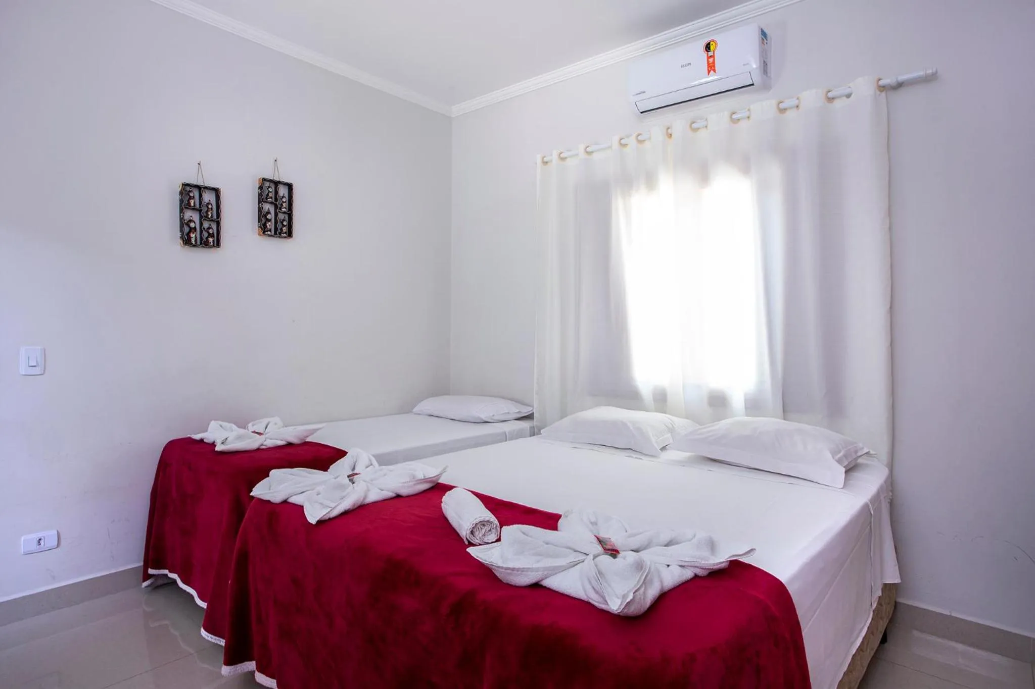 Bed in Pousada Guarubela Veloso