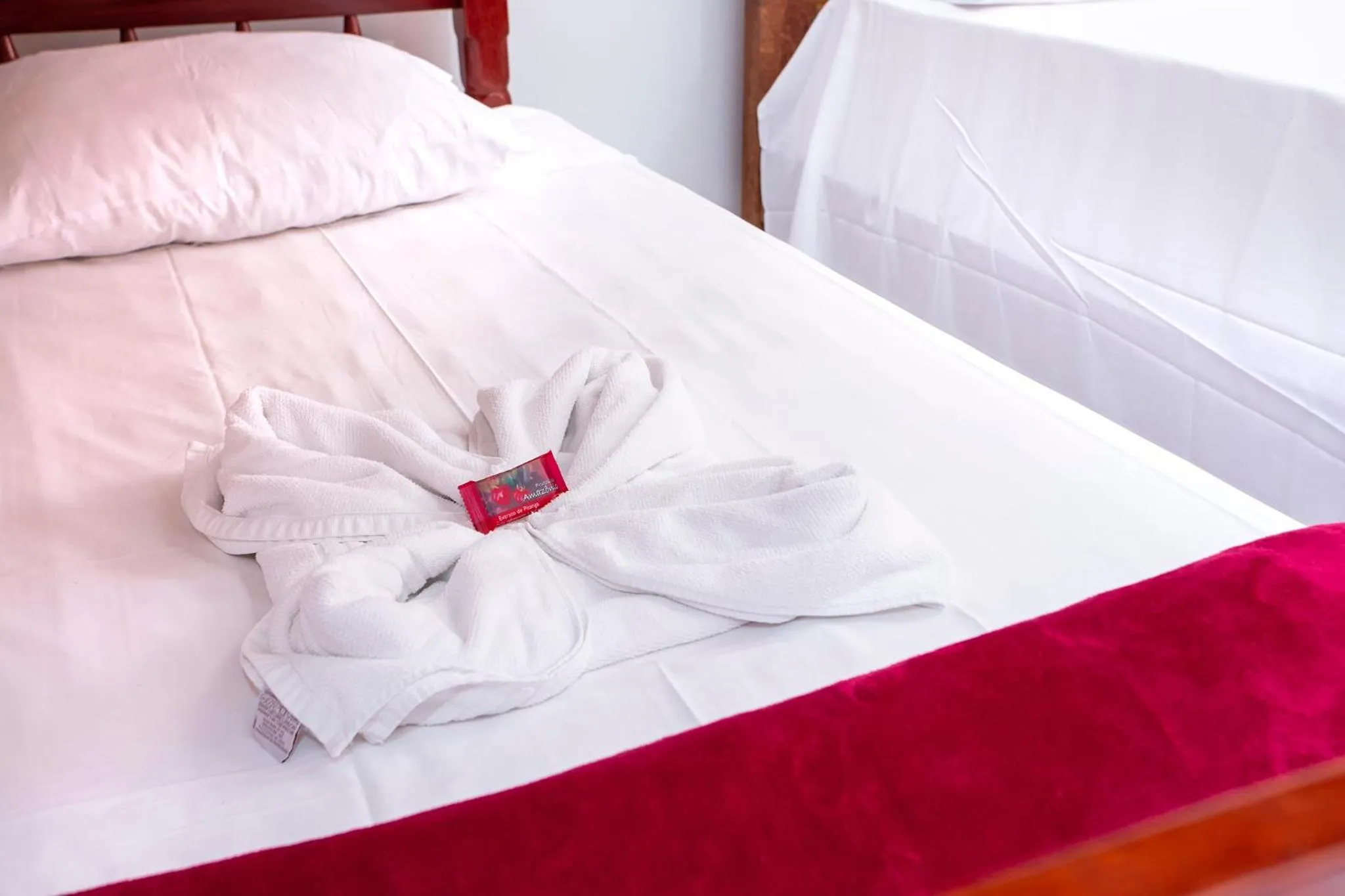 Bed in Pousada Guarubela Veloso