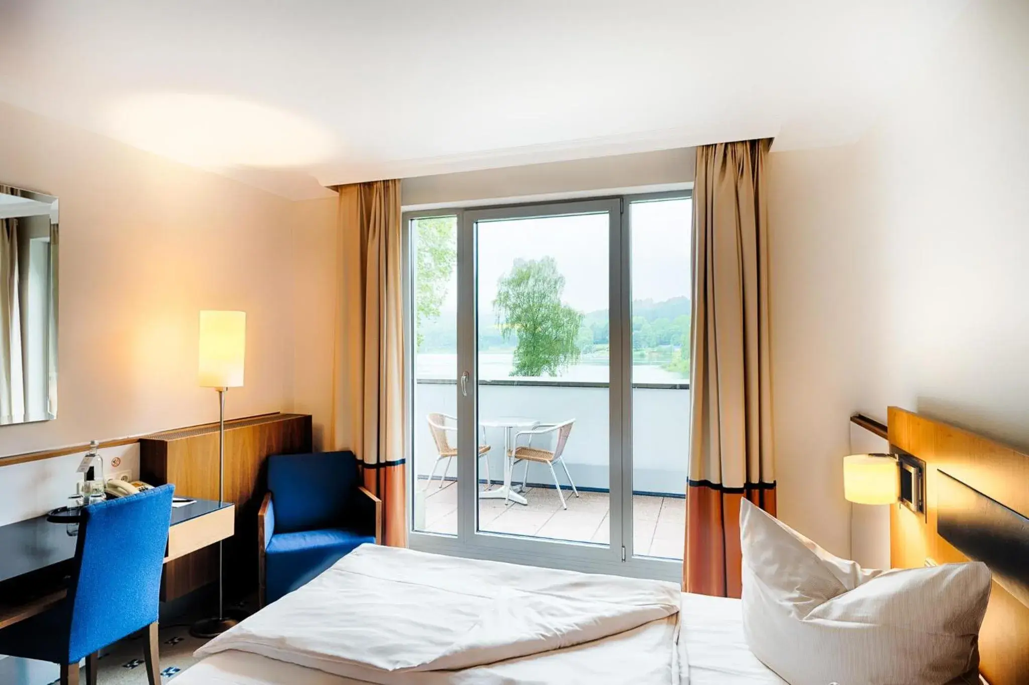 Deluxe Room with Balcony and Lake View in Welcome Hotel Meschede Hennesee Deluxe Room with Balcony and Lake View in Welcome Hotel Meschede Hennesee