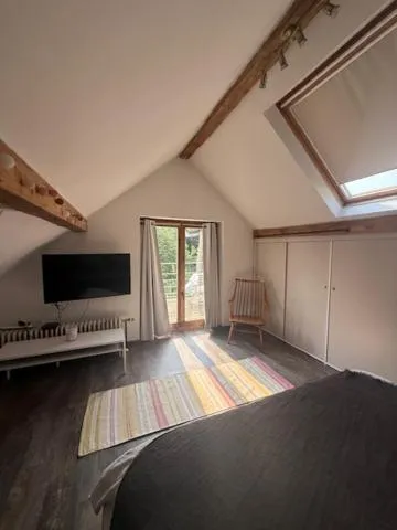 Bed in Le Jardin Des Secrets "Gites et chambres à louer"